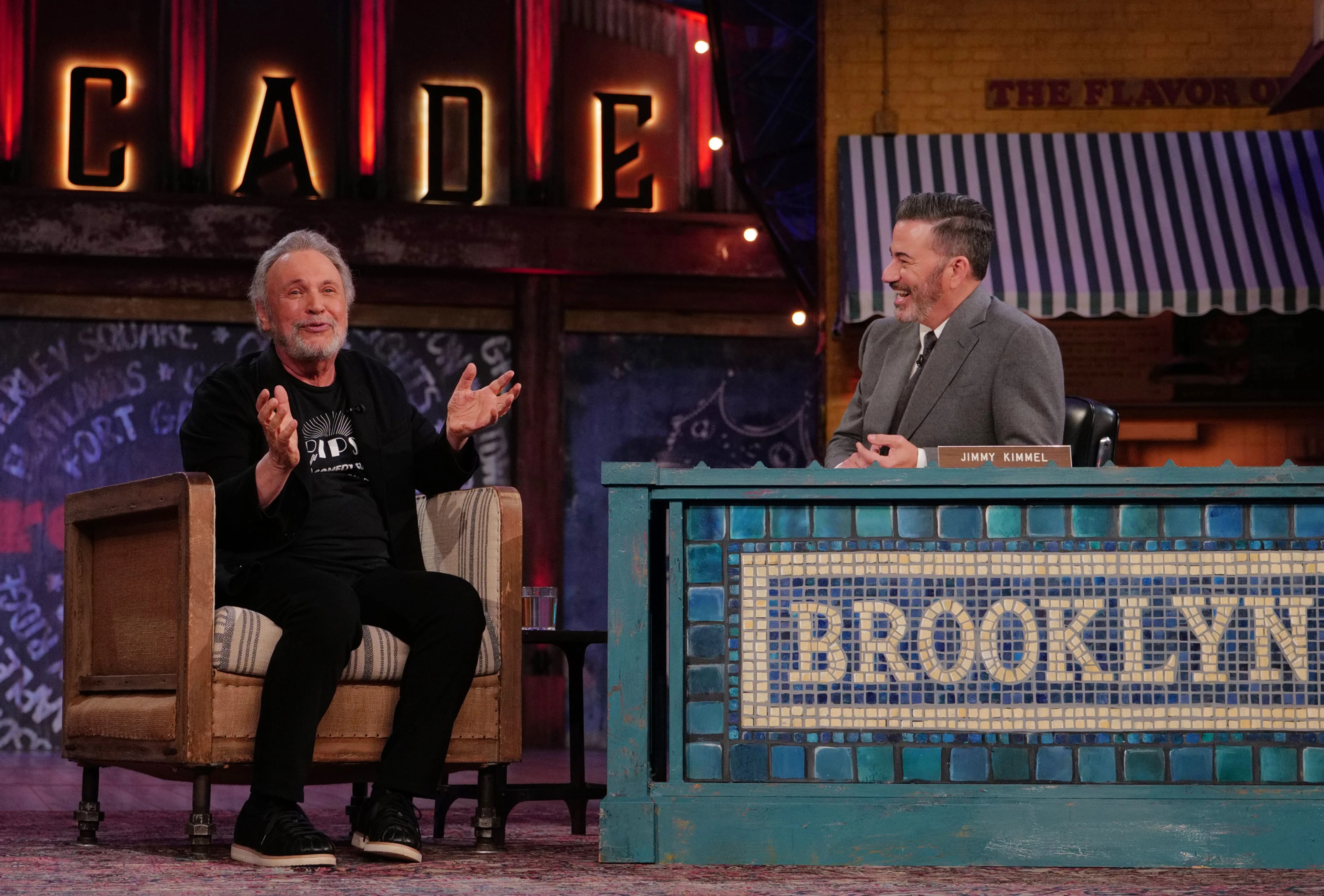 Billy Crystal gestures while talking with Jimmy Kimmel in the Brooklyn studio.