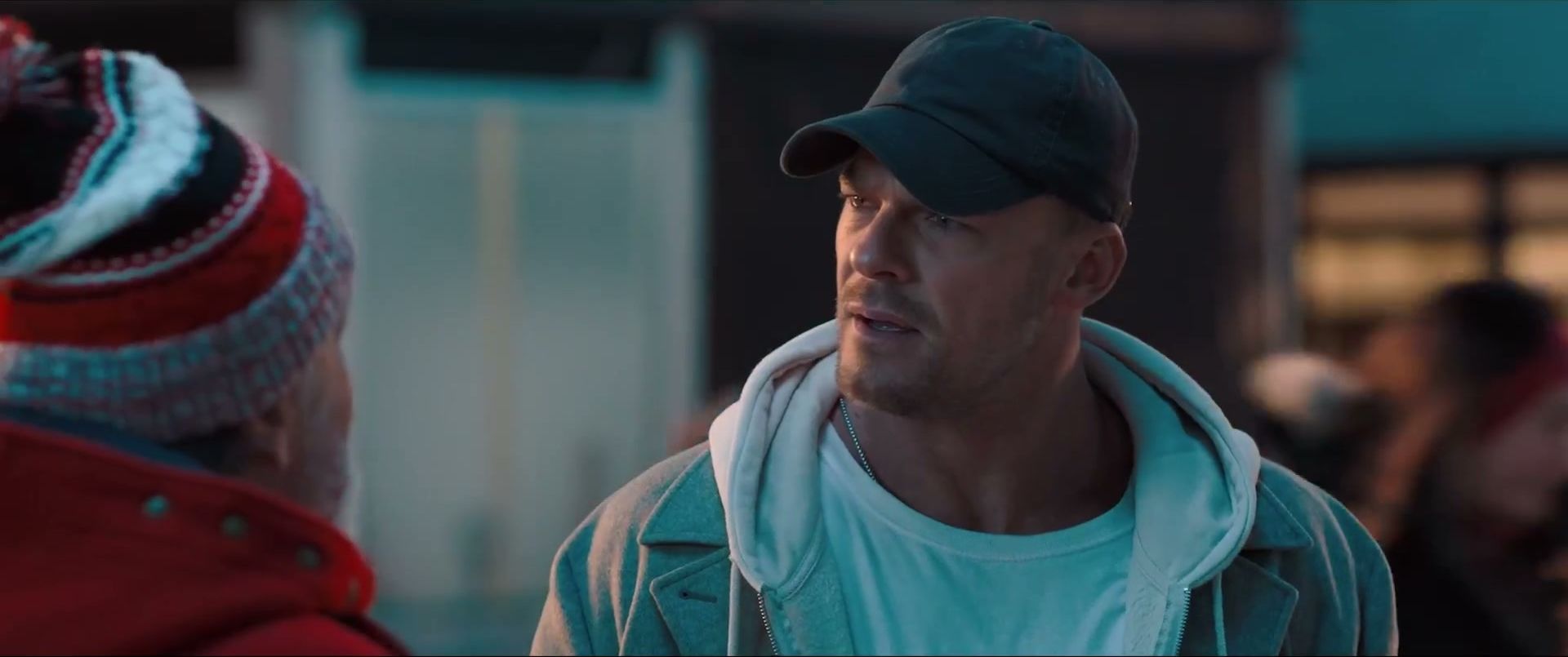 Alan Ritchson’s thief, wearing a dark cap, looks ahead in the teaser.
