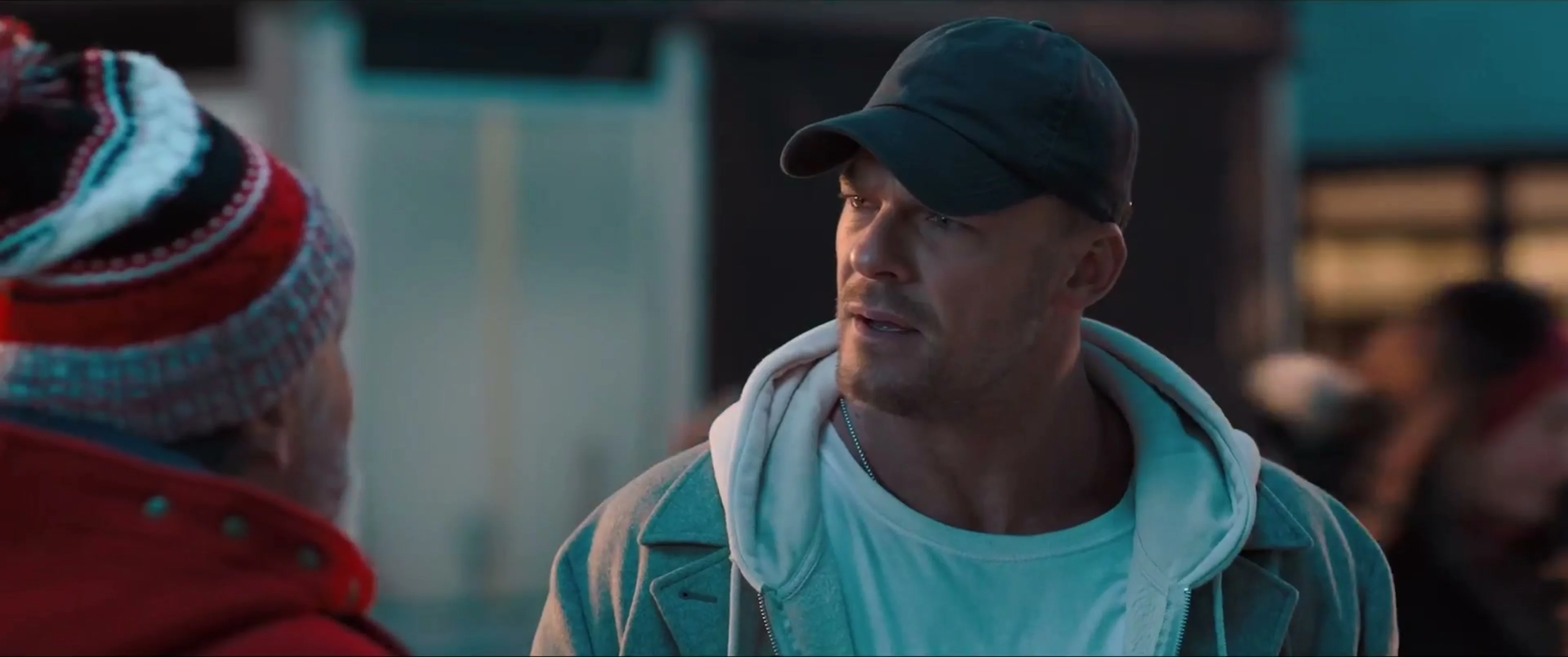 Alan Ritchson’s thief, wearing a dark cap, looks ahead in the teaser.