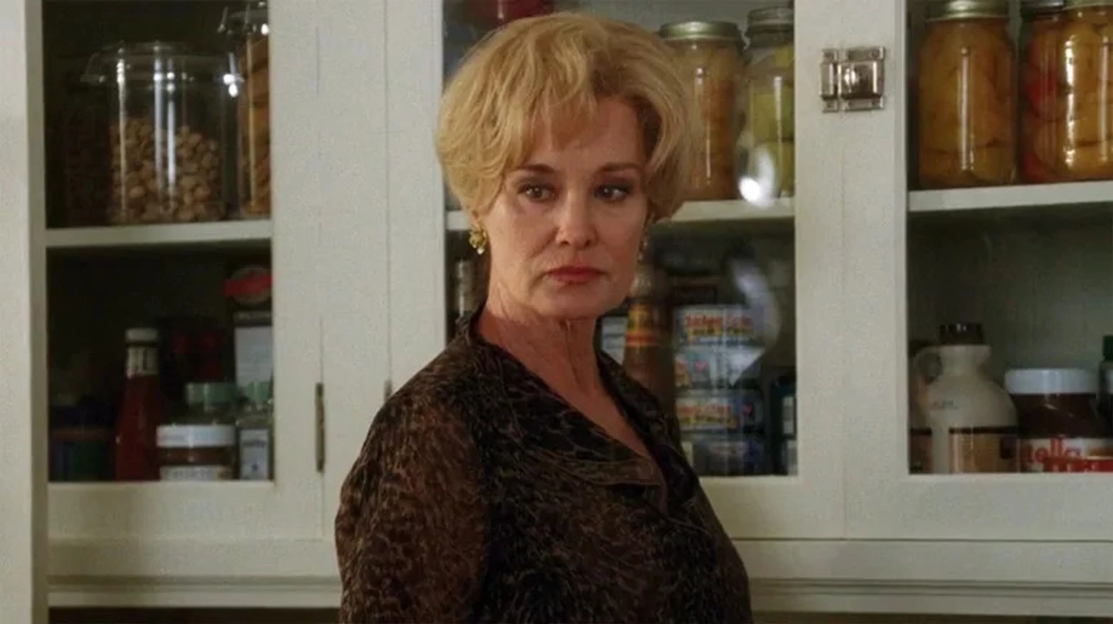 Jessica Lange appears in a kitchen in the American Horror Story Season 13 trailer.