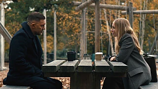 Tom Hardy as Harry Da Souza speaks with Joanne Froggatt in an official MobLand Season 2 still.