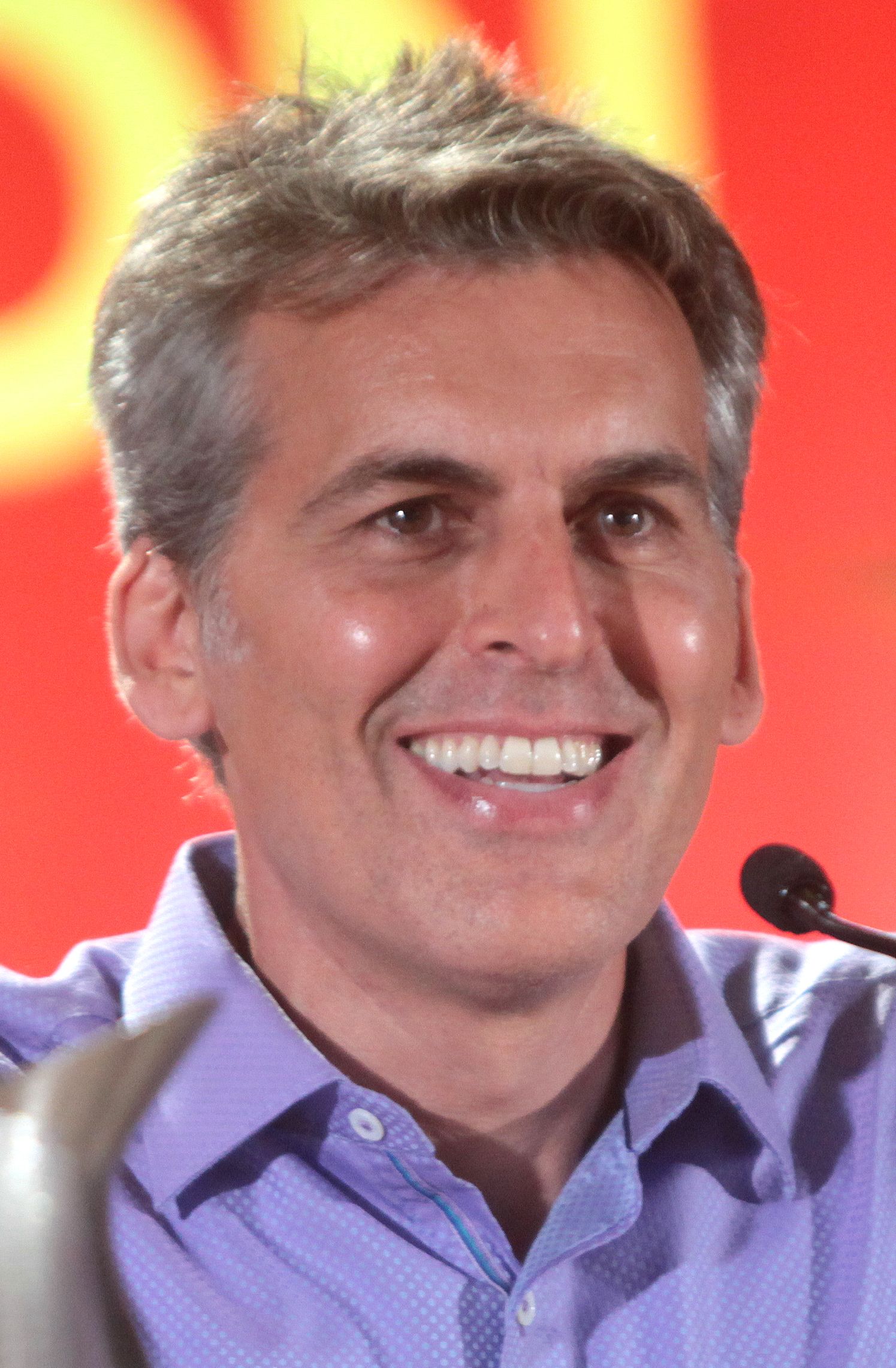 Oded Fehr smiles while speaking during a 2016 Phoenix Comicon panel.