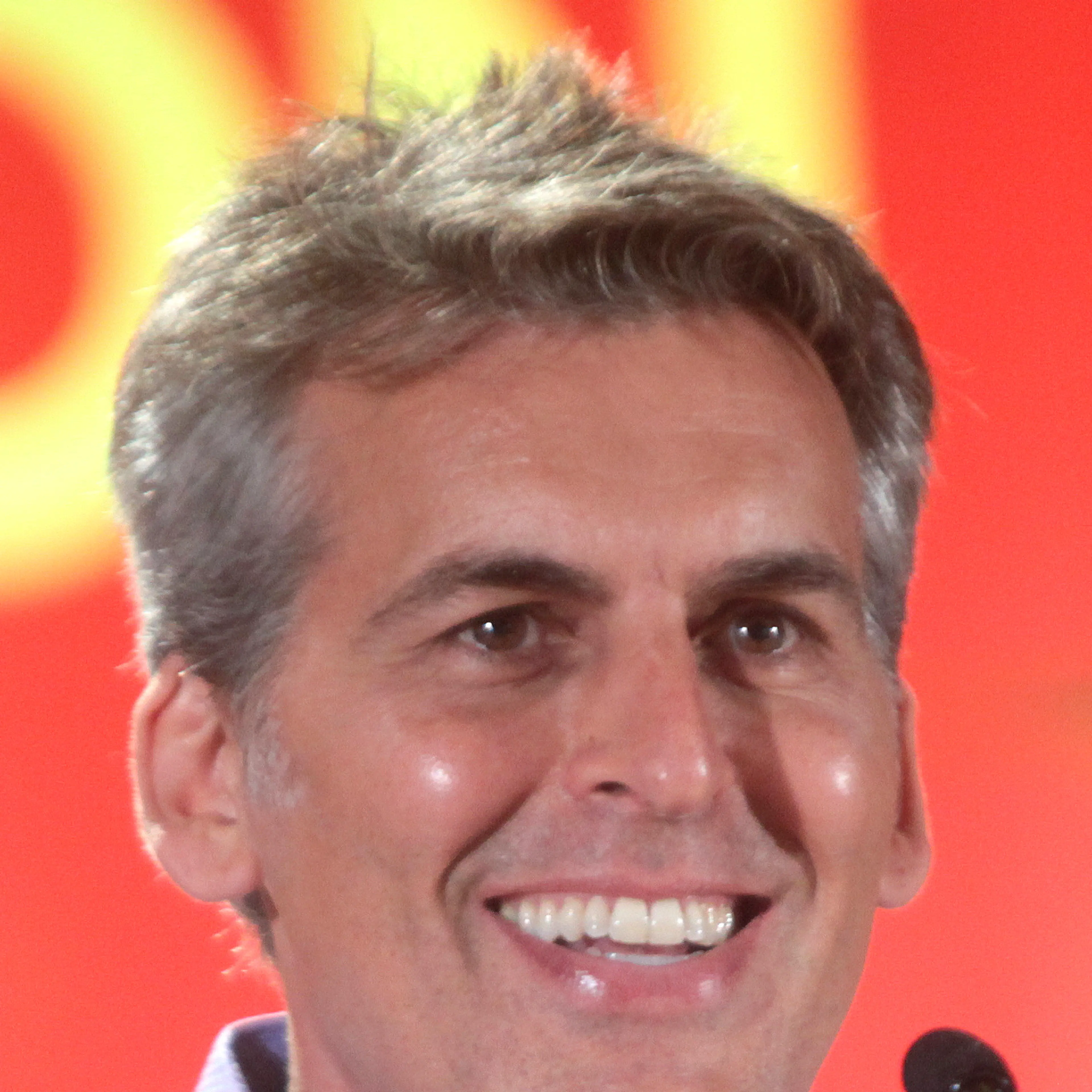 Oded Fehr smiles while speaking during a 2016 Phoenix Comicon panel.