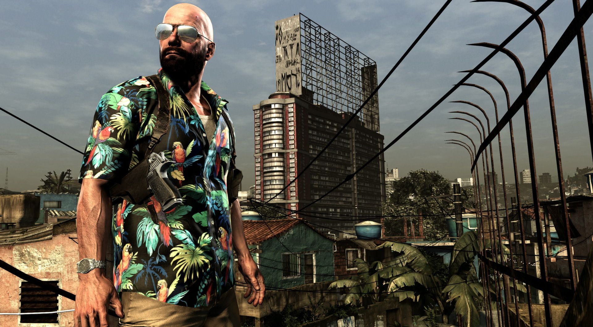 Max stands above São Paulo rooftops in a bright patterned shirt.