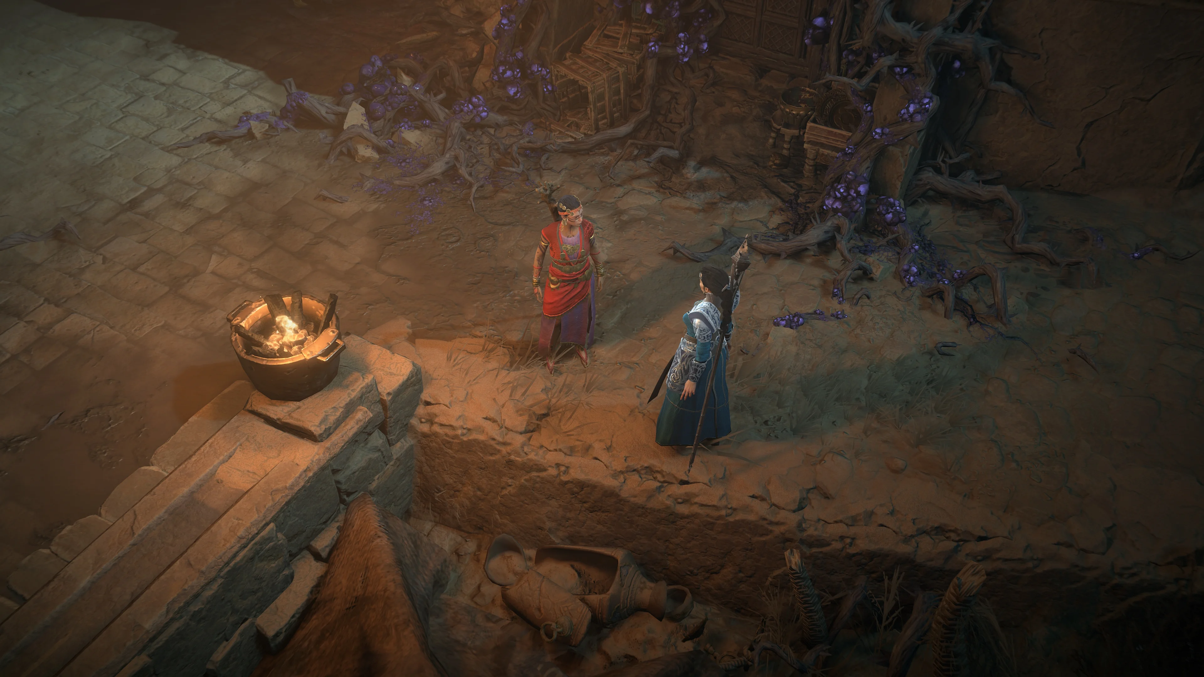 Diablo IV characters gathered around an altar in gameplay
