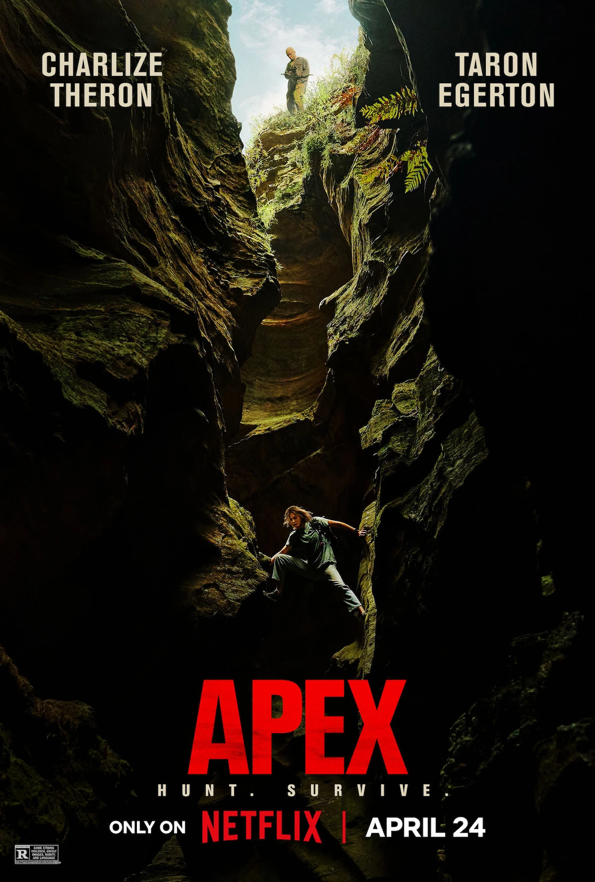 Official Apex poster with Charlize Theron below Taron Egerton in a rocky ravine.