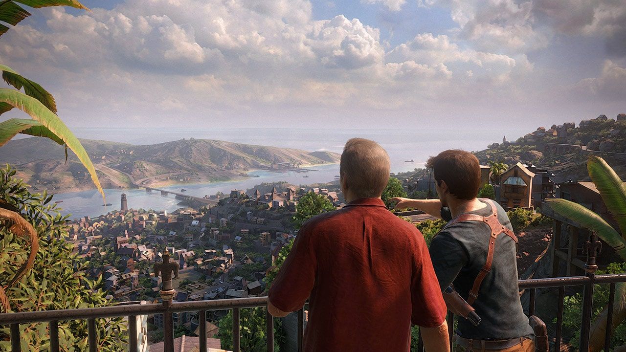 Sully and Nathan standing at a railing above a coastal town.