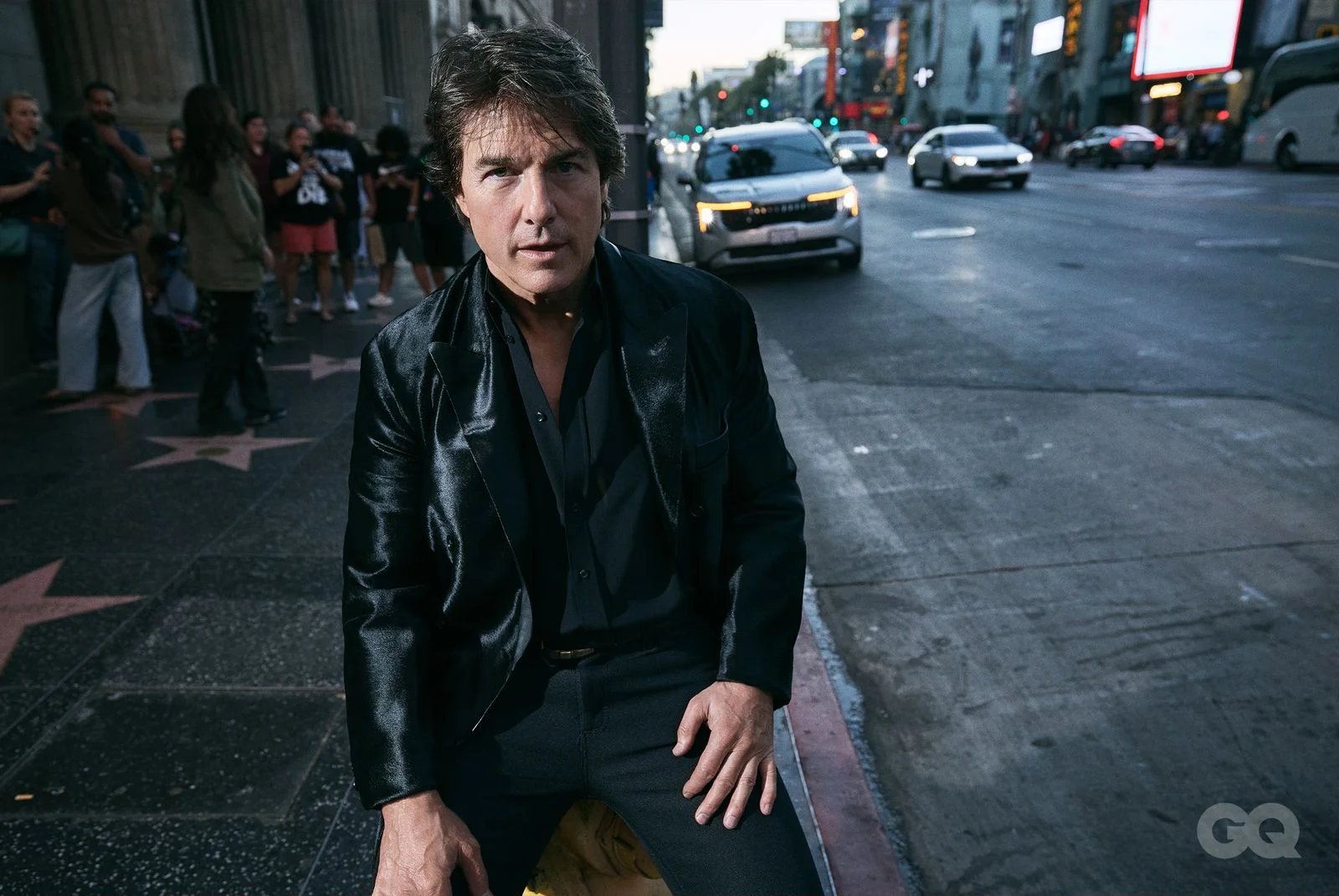 Tom Cruise in a dark suit on Hollywood Boulevard during the GQ photo shoot.