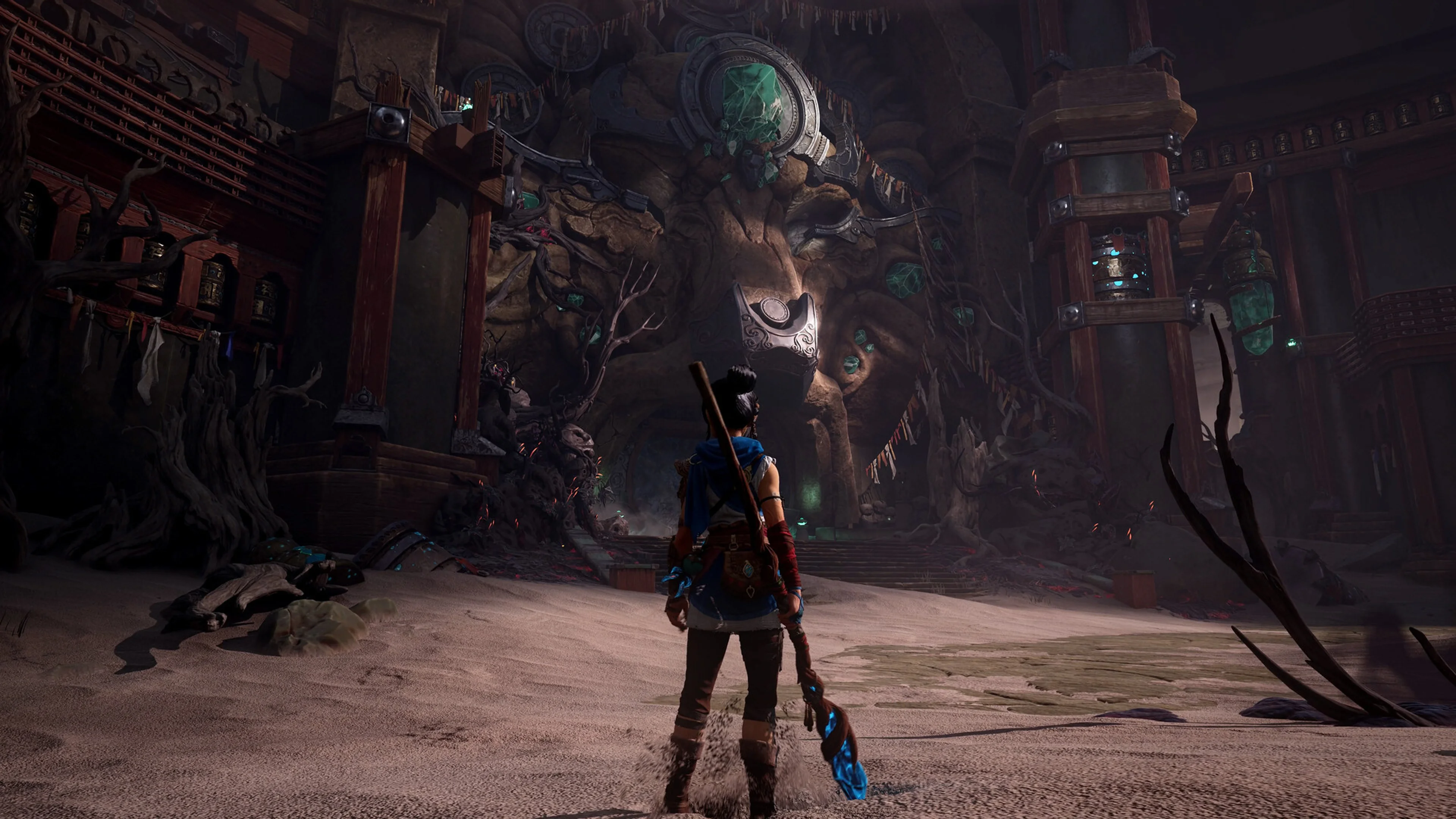 Kena standing inside Tahra Temple in Kena: Scars of Kosmora.