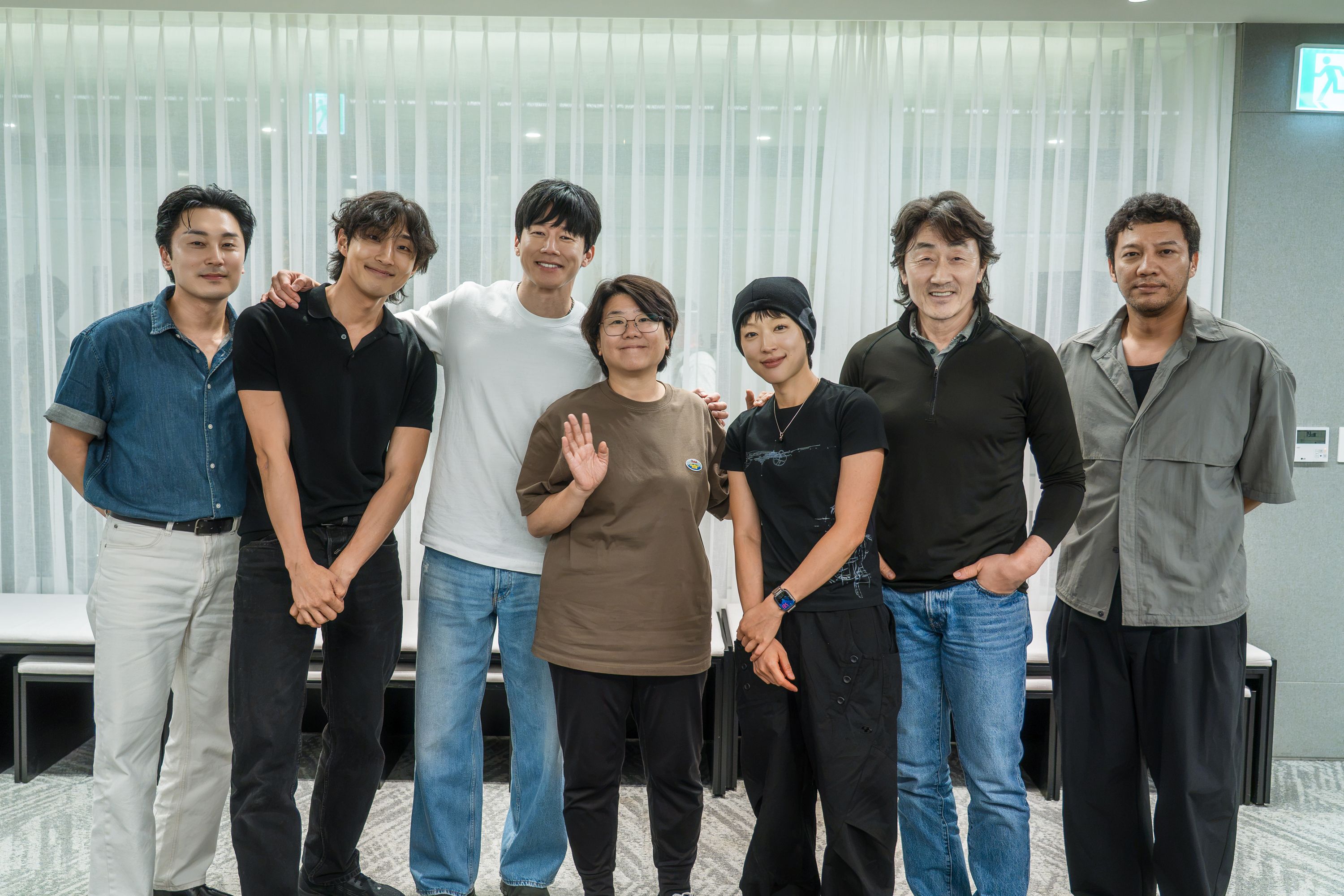 The cast of Netflix’s The Shooter stands together in an official production photo.