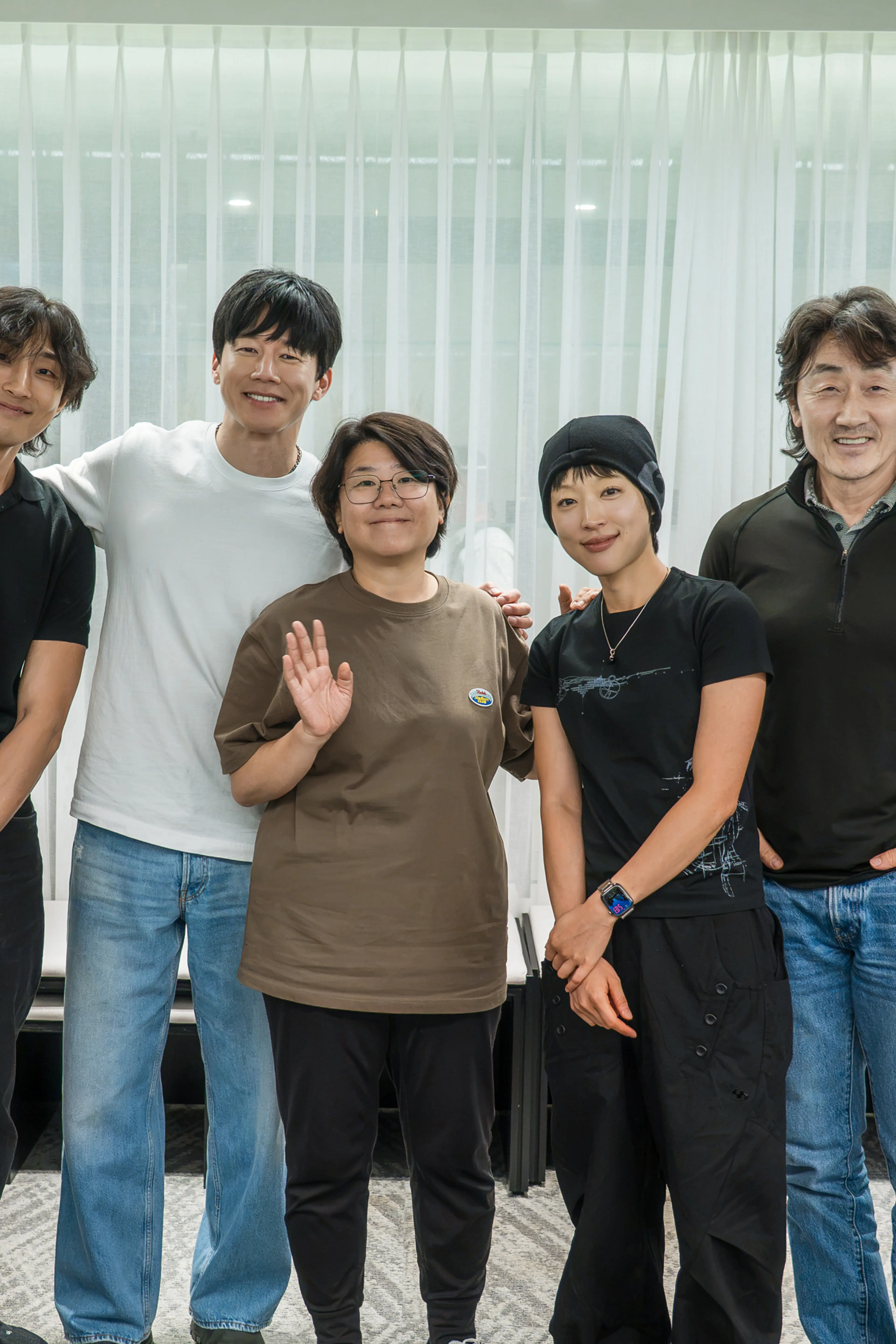 The cast of Netflix’s The Shooter stands together in an official production photo.