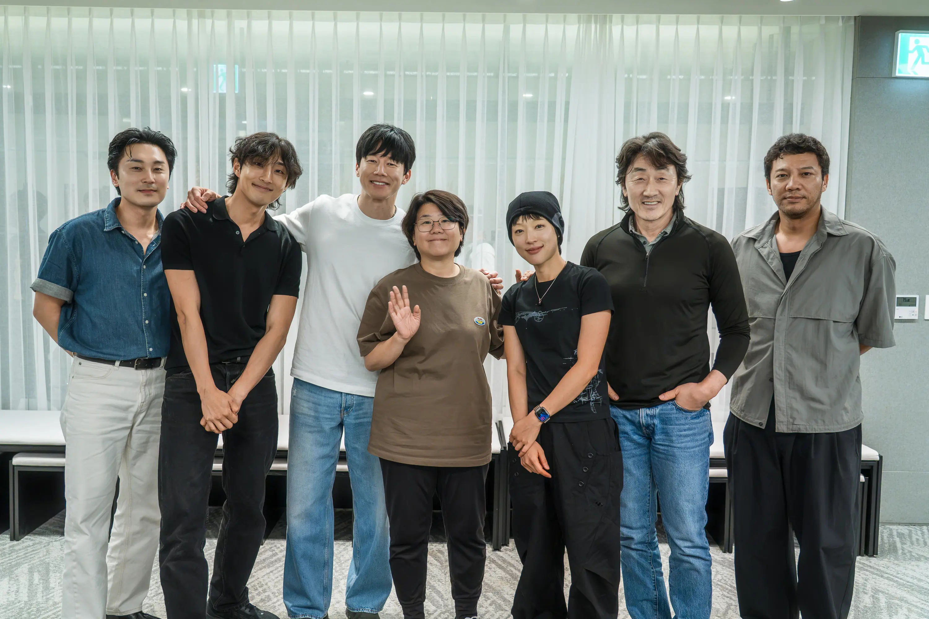 The cast of Netflix’s The Shooter stands together in an official production photo.