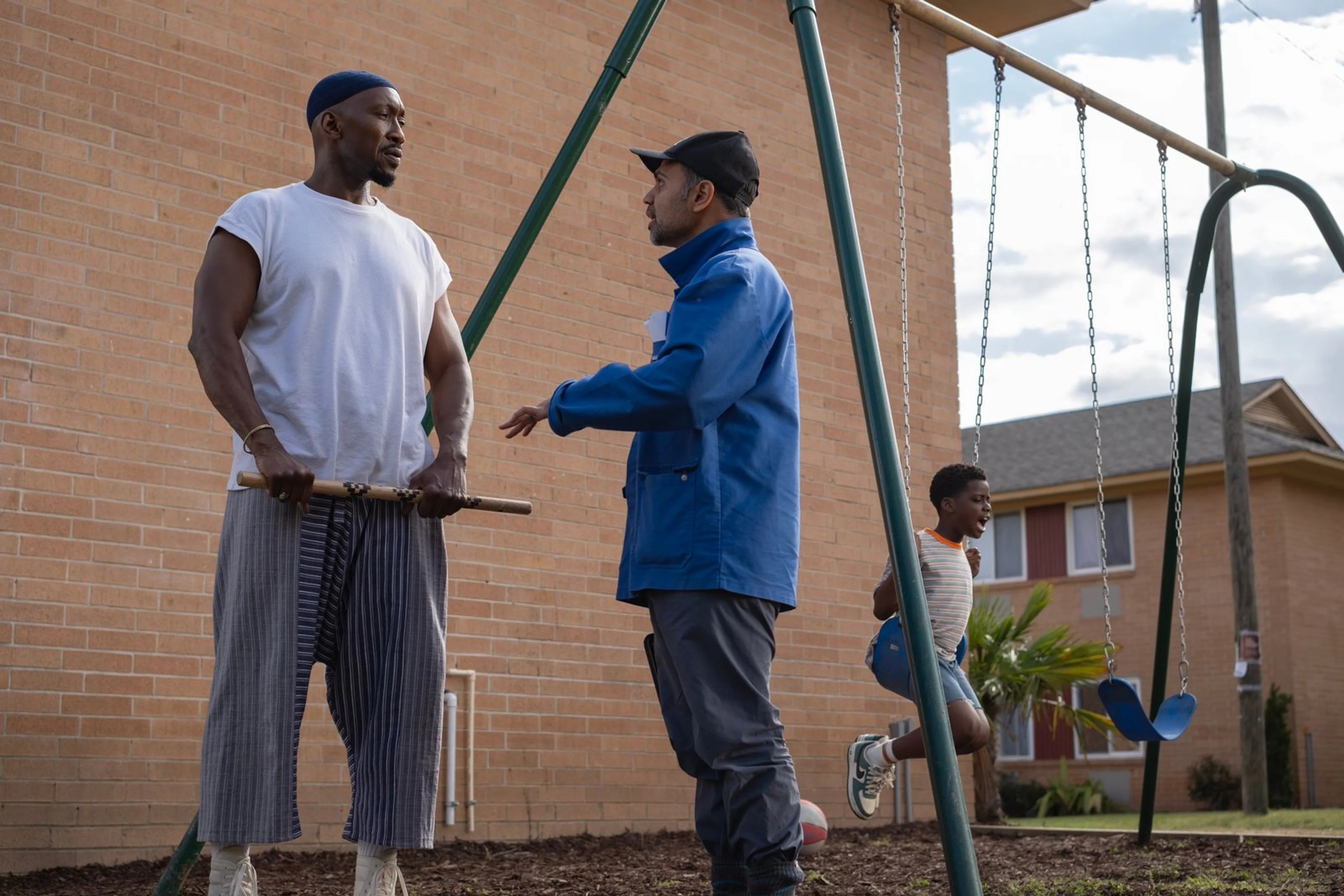 Mahershala Ali and director Bassam Tariq speak on the film set.