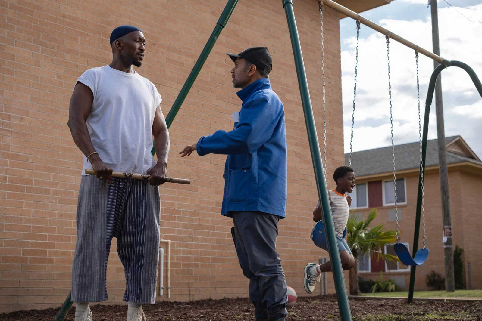 Mahershala Ali and director Bassam Tariq speak on the film set.