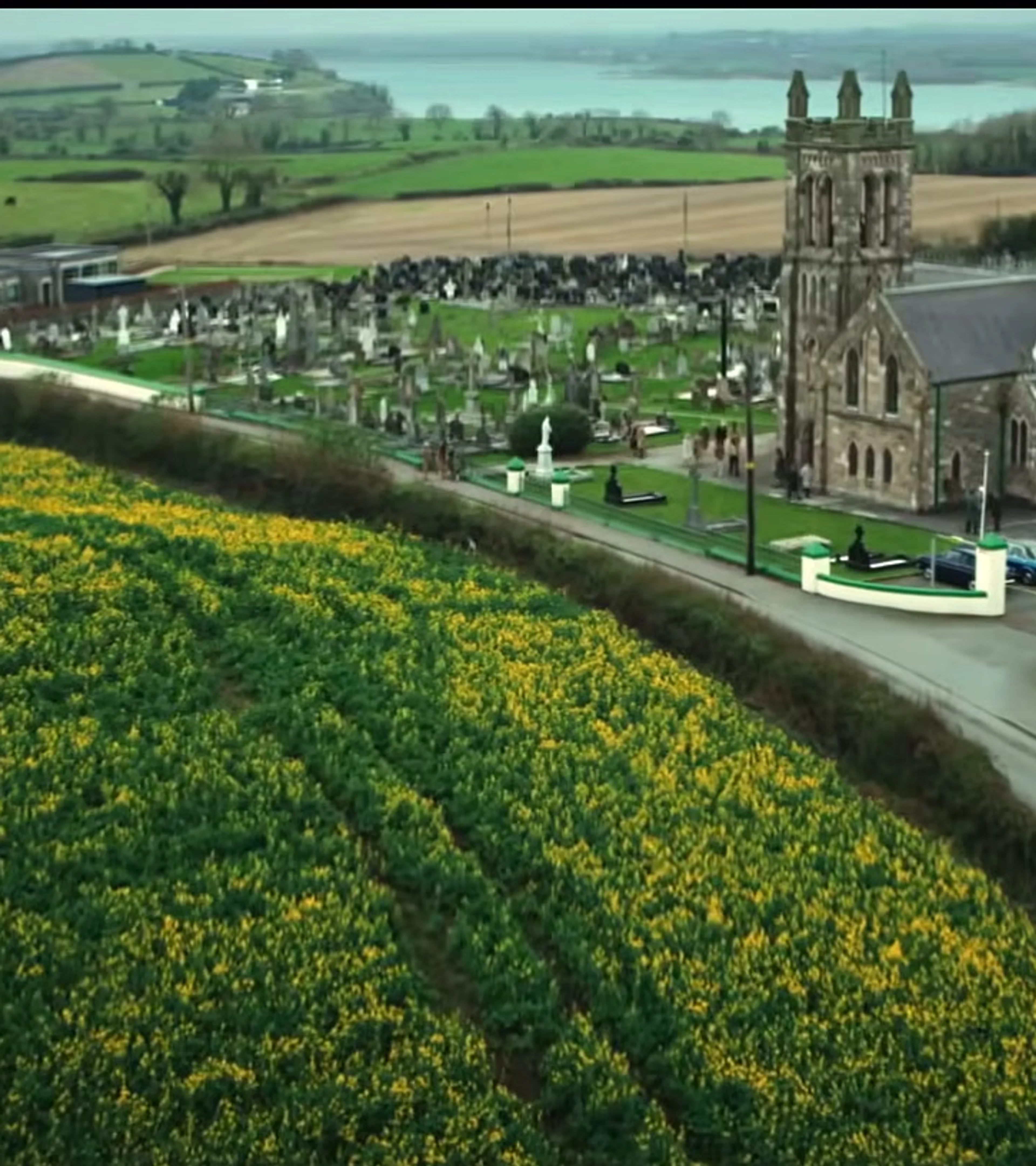 A church and green fields establish Northern Ireland in 1975 at the start of Trespasses.