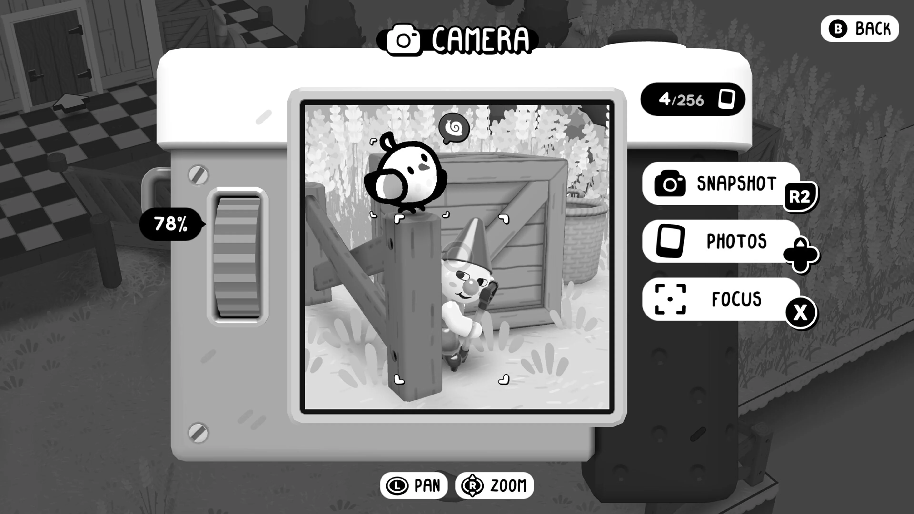 TOEM 2 camera screen frames a tiny character near a fence.