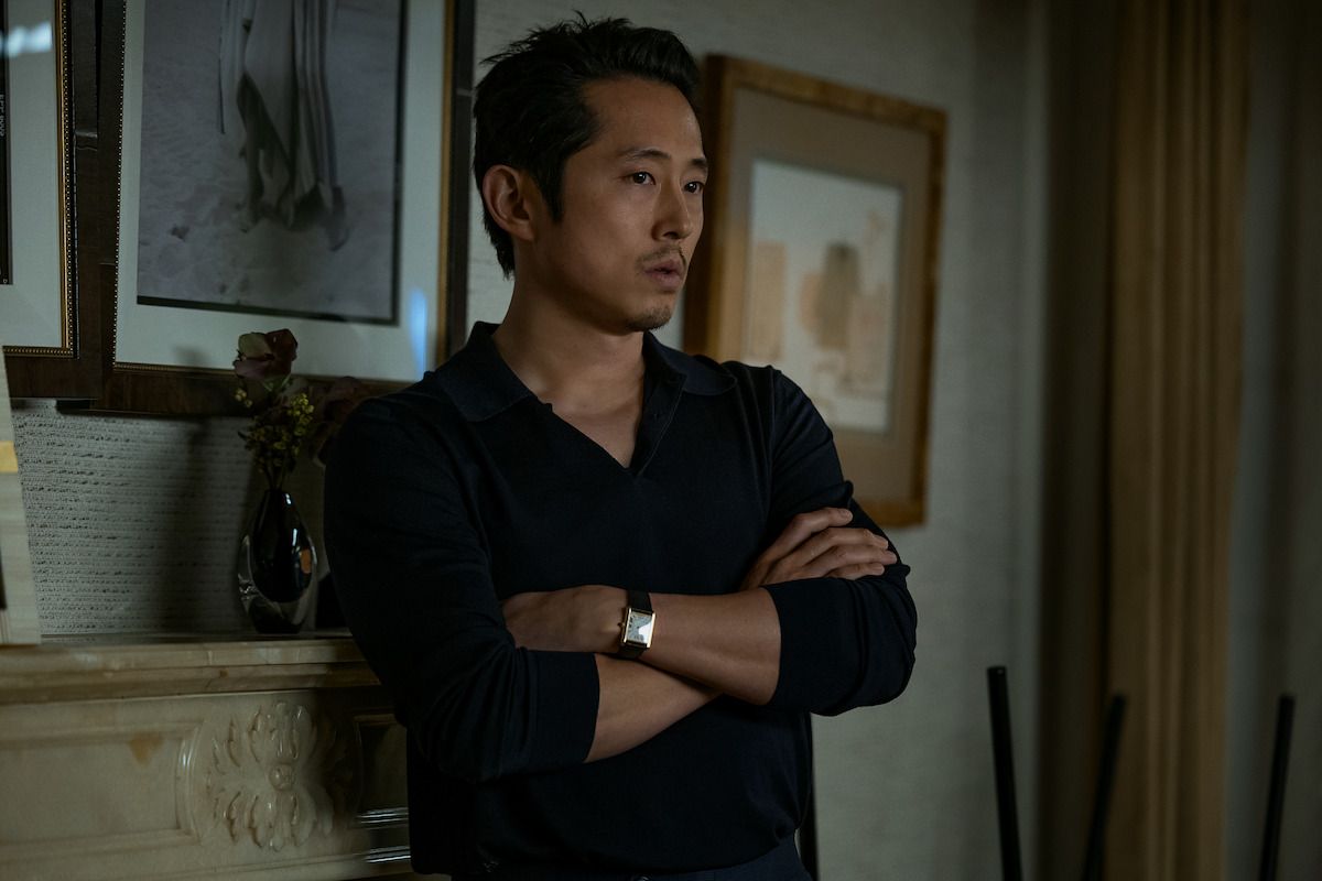 Steven Yeun in a black shirt in an official Animals production photograph.