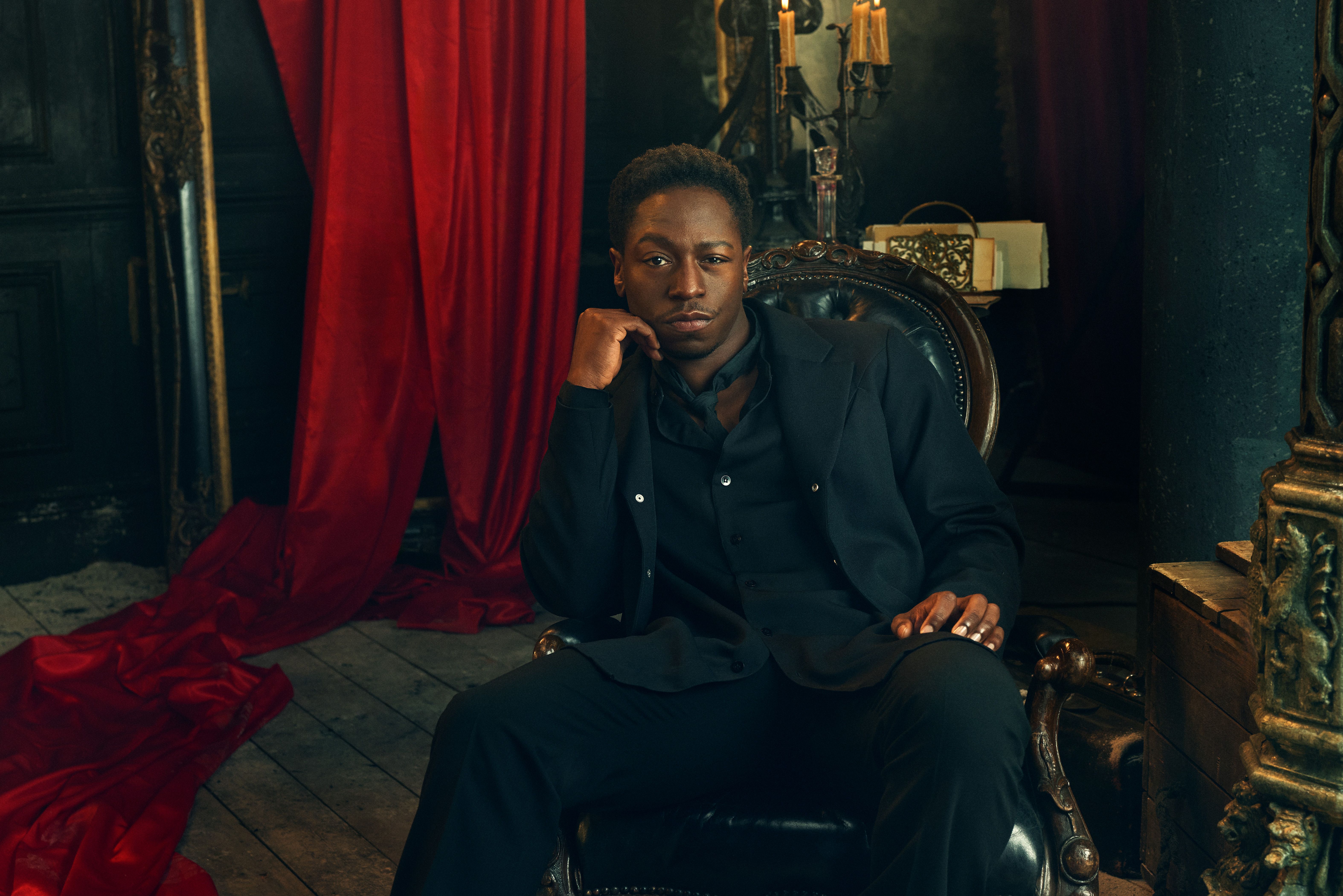 David Jonsson wears a black suit in an official Dracula audio-drama portrait.