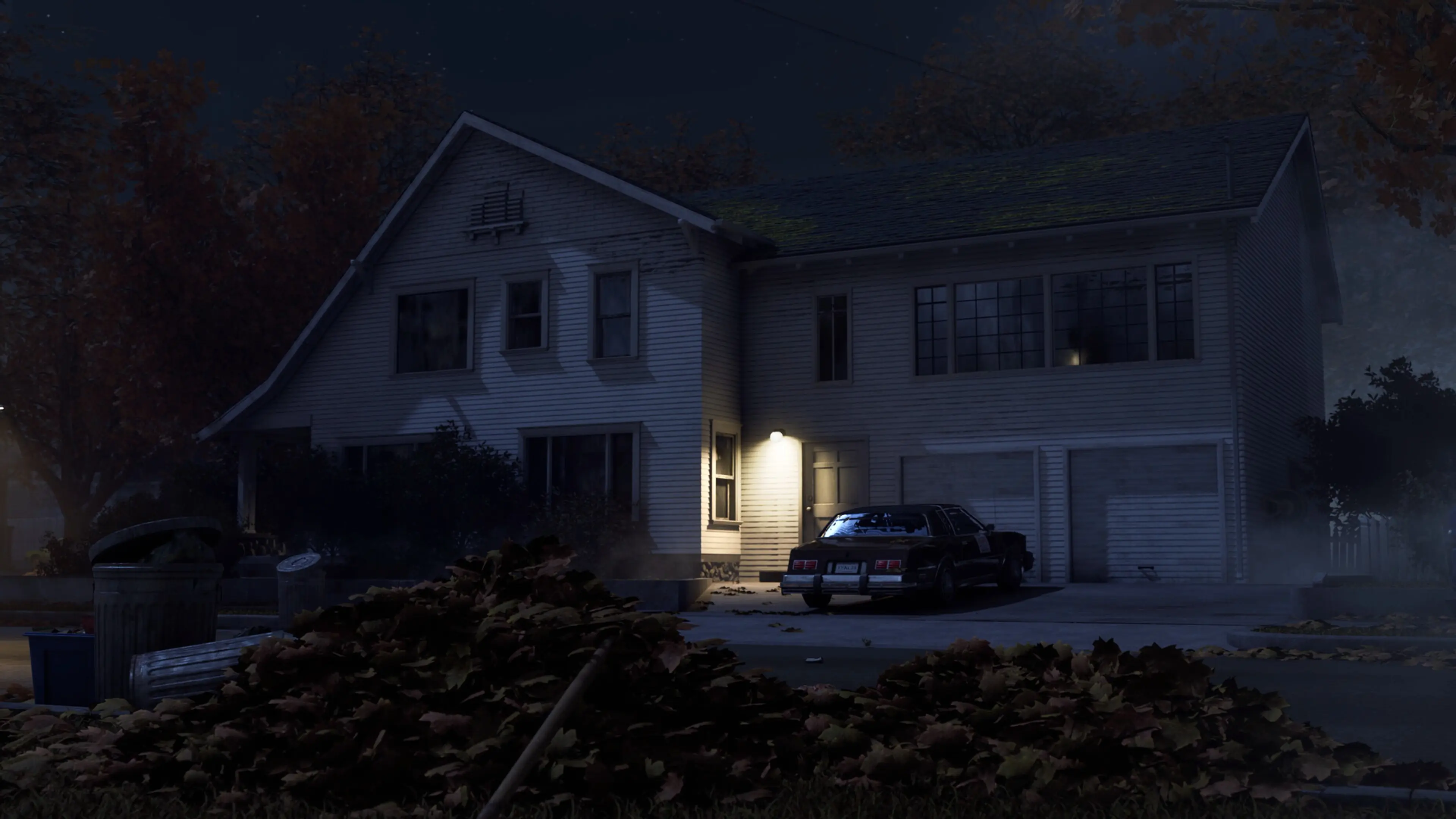 A police car is parked outside a dark Haddonfield house in Halloween: The Game.