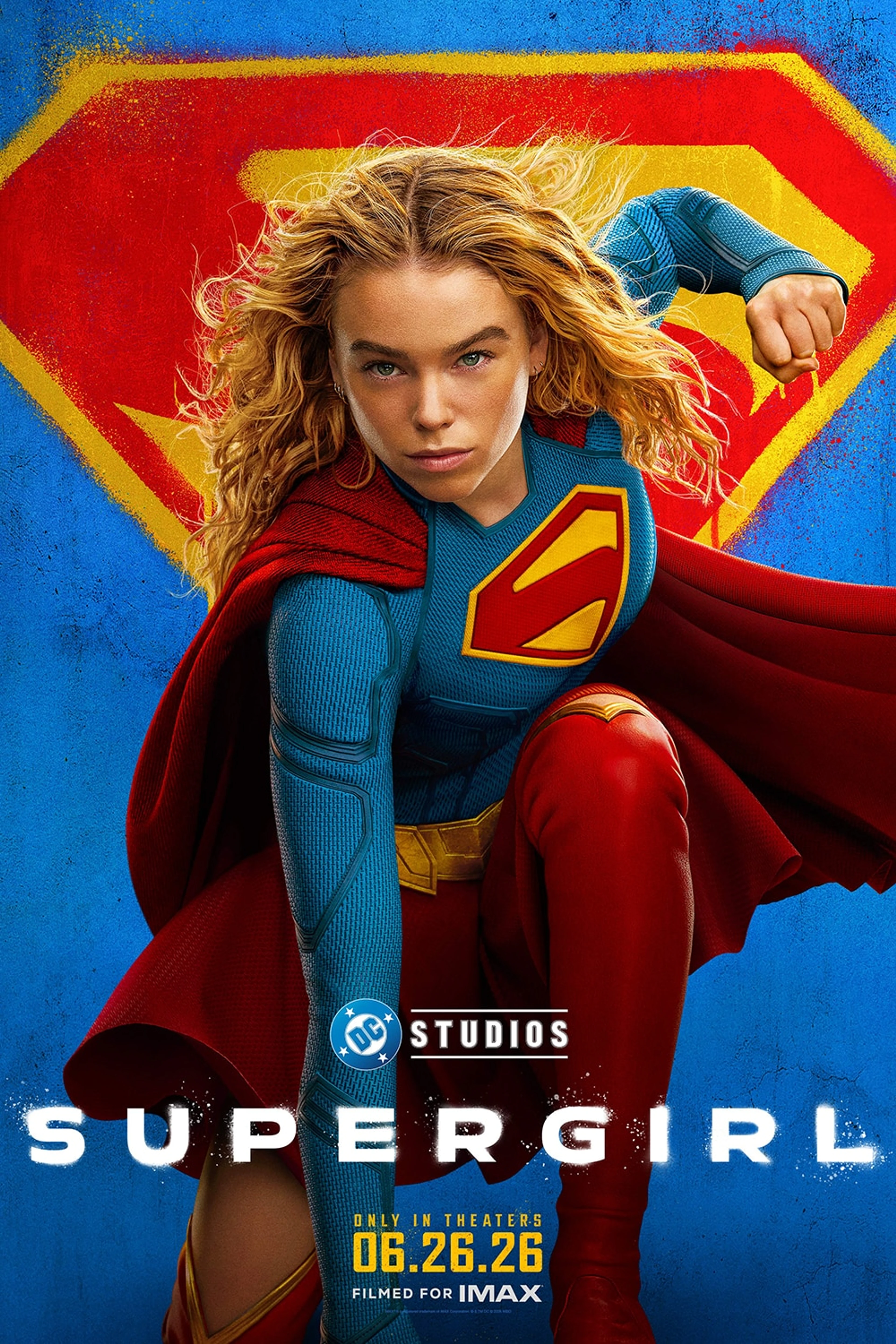 Milly Alcock as Supergirl in a blue suit and red cape on the official Supergirl poster.