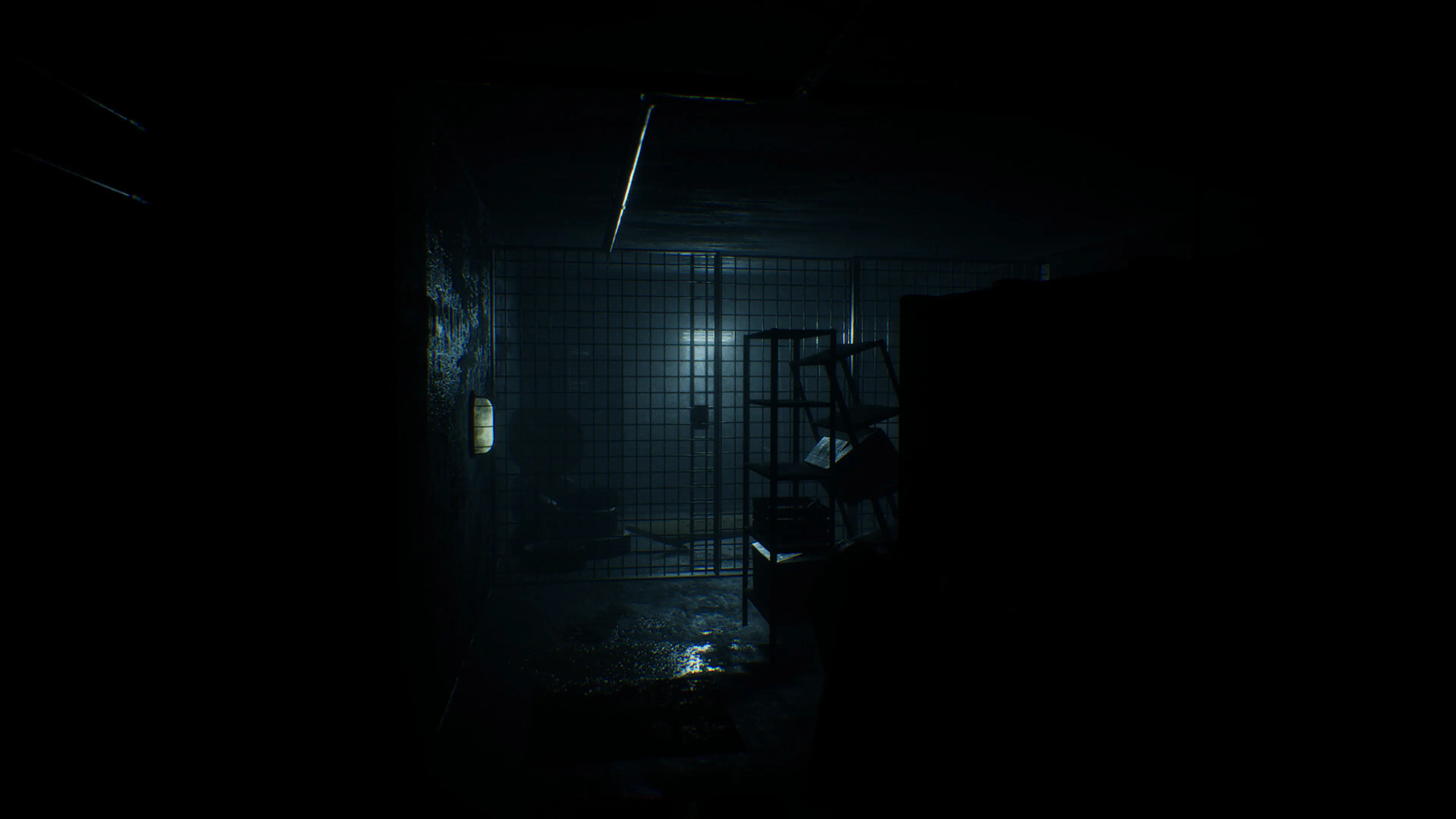 A dark corridor and metal door in We Are Sisters.