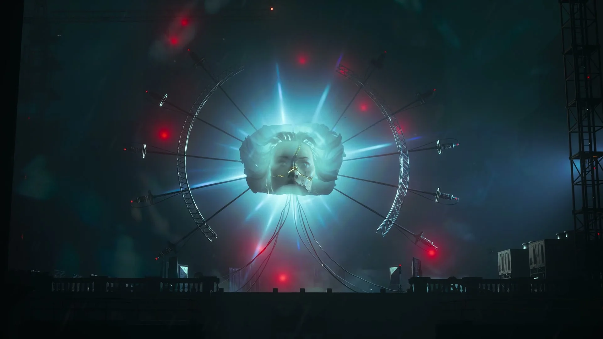 An uncanny luminous object hangs over a dark, broken cityscape.