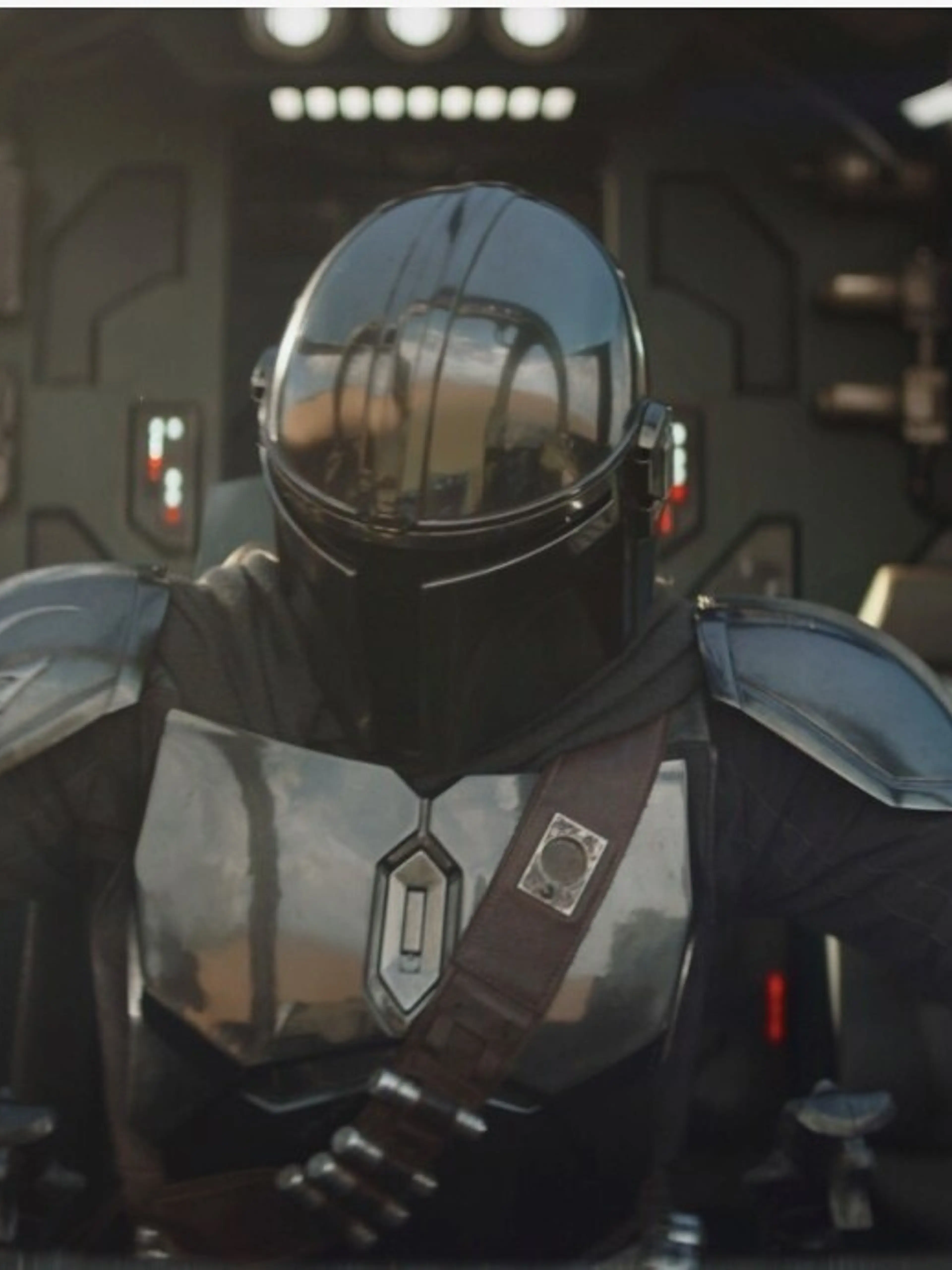 The Mandalorian standing with Grogu