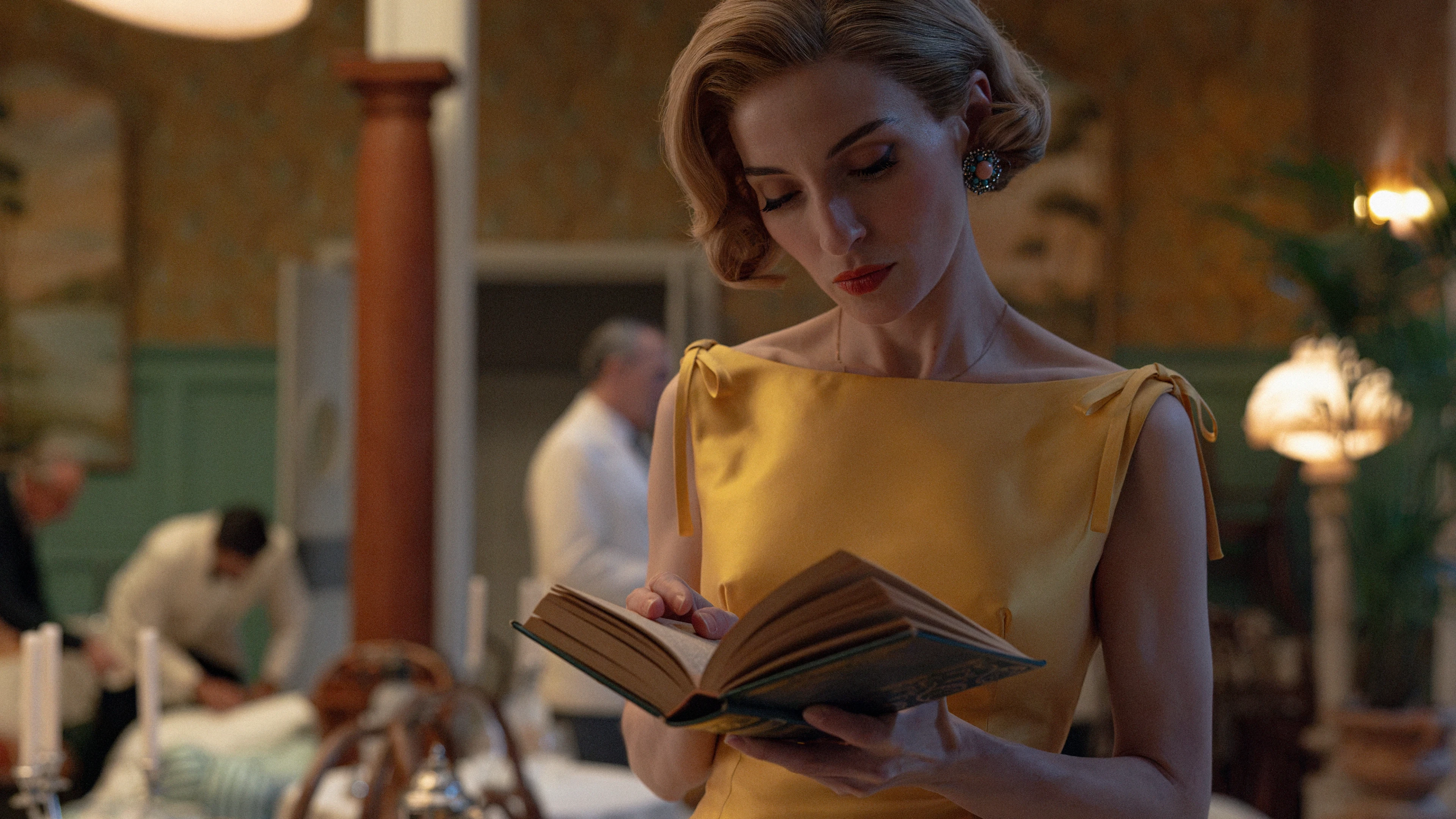 A woman reads a book inside the hotel in Netflix’s The Final Problem.