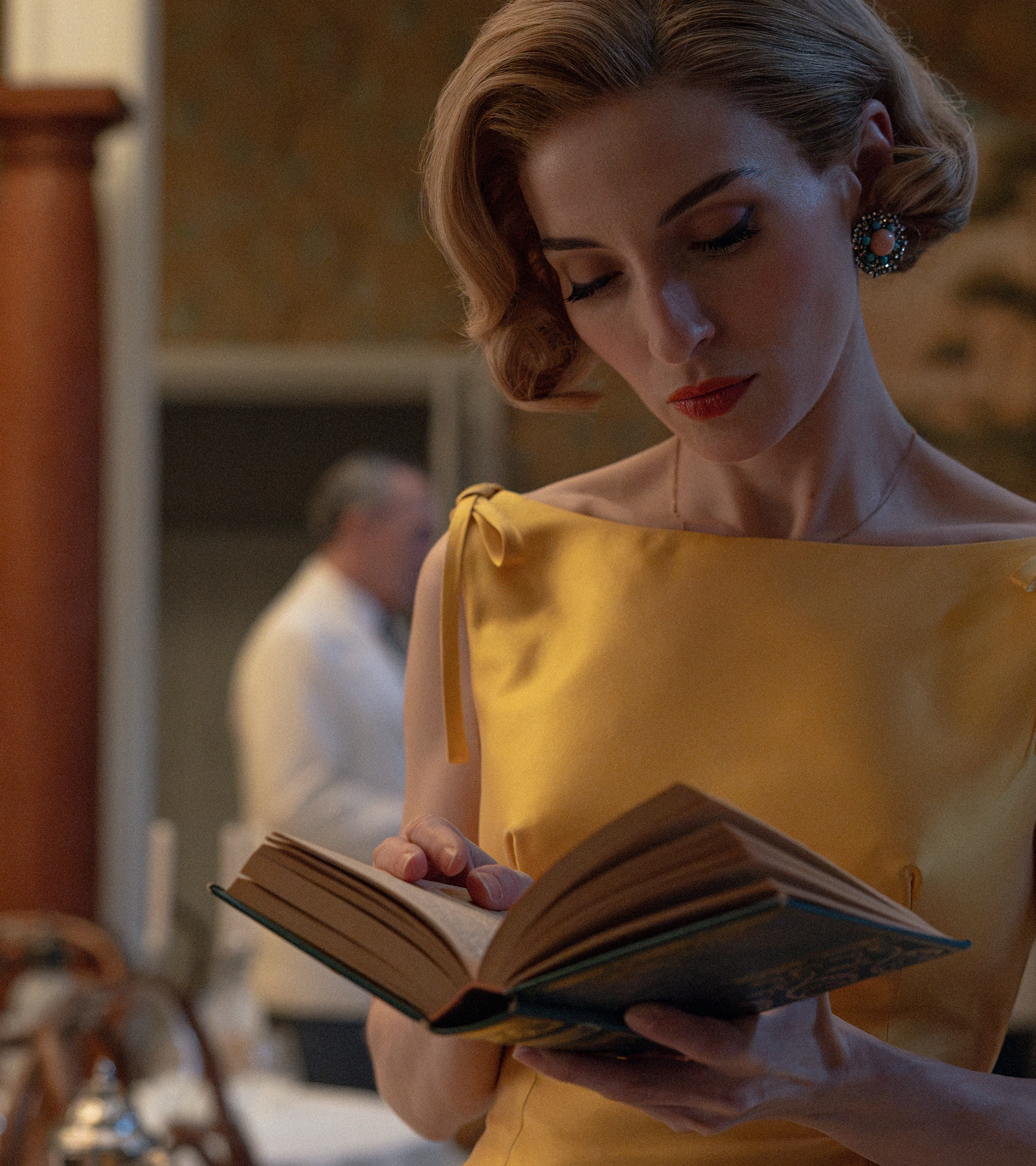 A woman reads a book inside the hotel in Netflix’s The Final Problem.