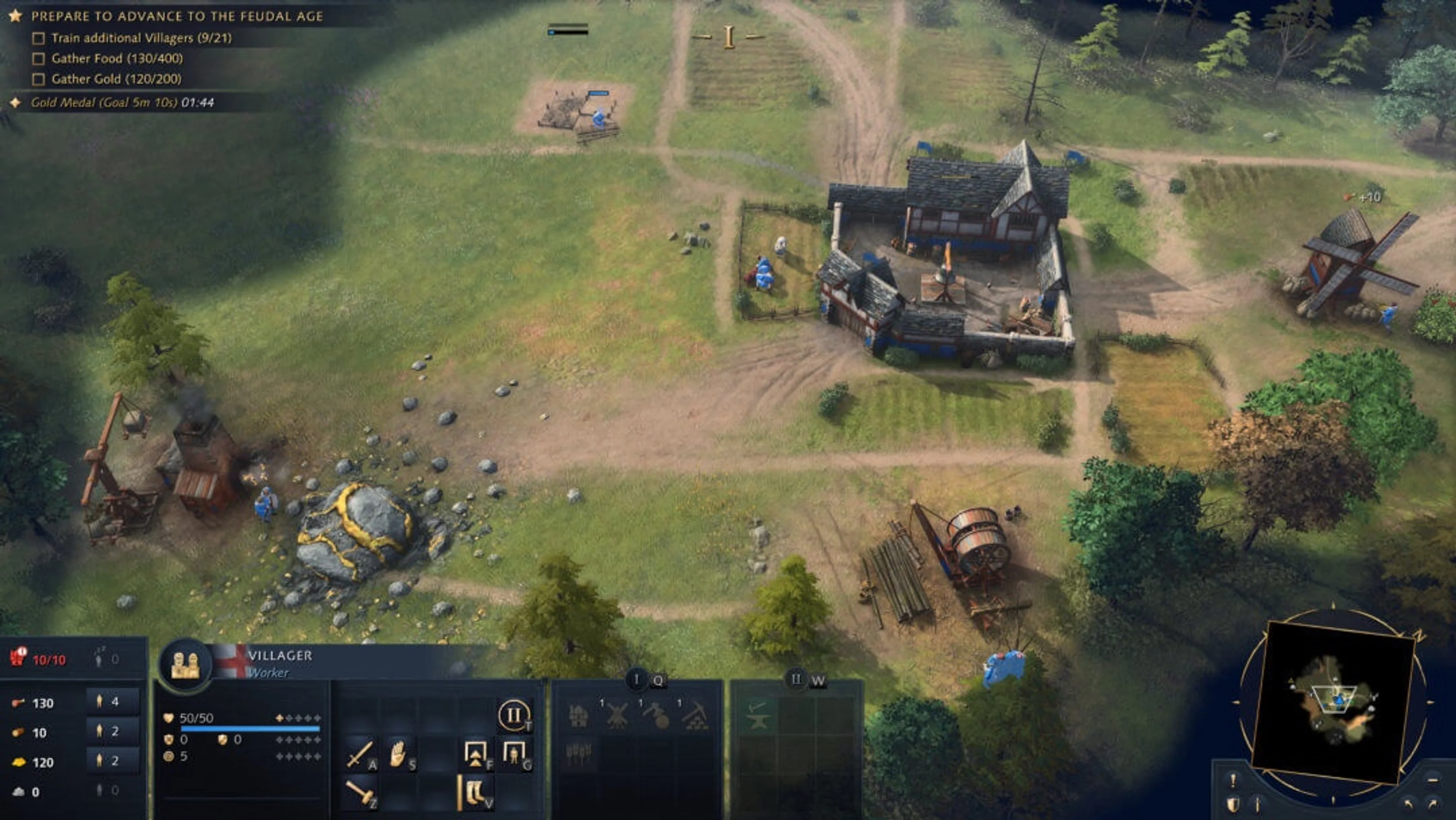 The gold deposit is the large rock with yellow veins at lower left, beside a Mining Camp. The red 10/10 population display shows this settlement needs more space. The selected villager’s circular II button is the age-up control in this training interface.