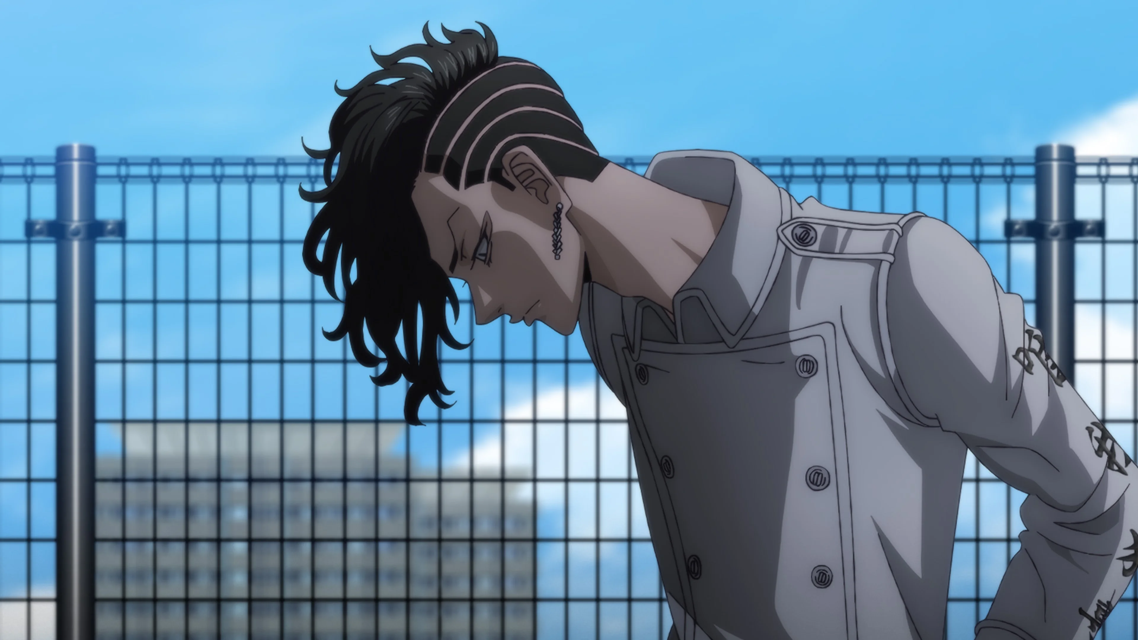 A battered fighter appears in a tense frame from the official Tokyo Revengers War of the Three Titans Arc trailer.