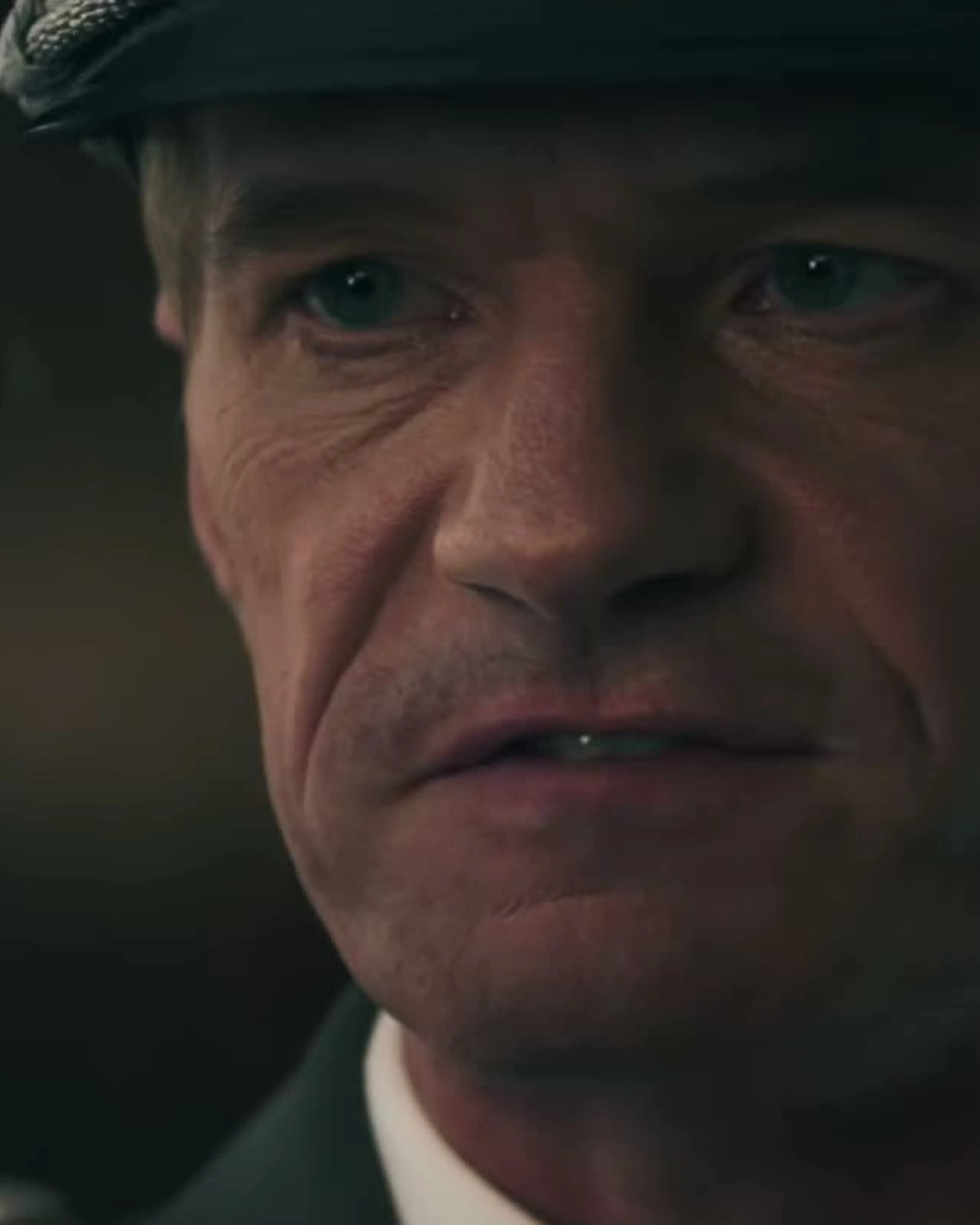 Neil Patrick Harris wears a military cap as Wilhelm Reuss, holding a key in The Last Temptation of Becky.