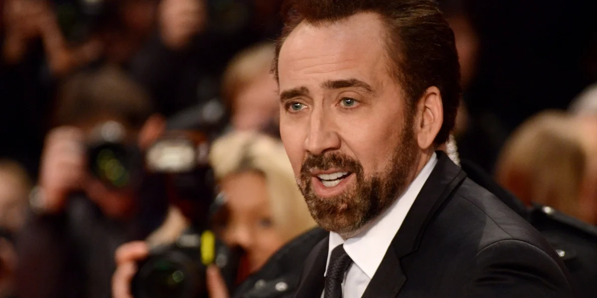 Nicolas Cage attends a film event in a dark suit.