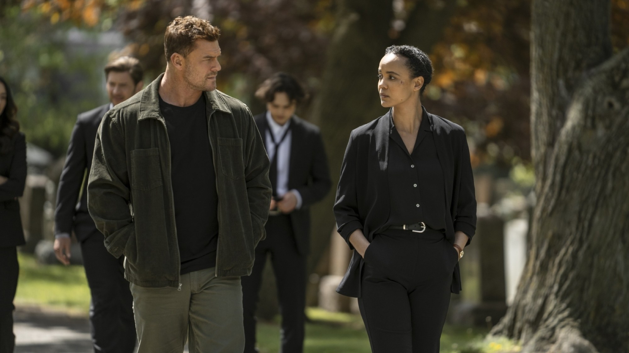 Jack Reacher and Frances Neagley walk together at a funeral.