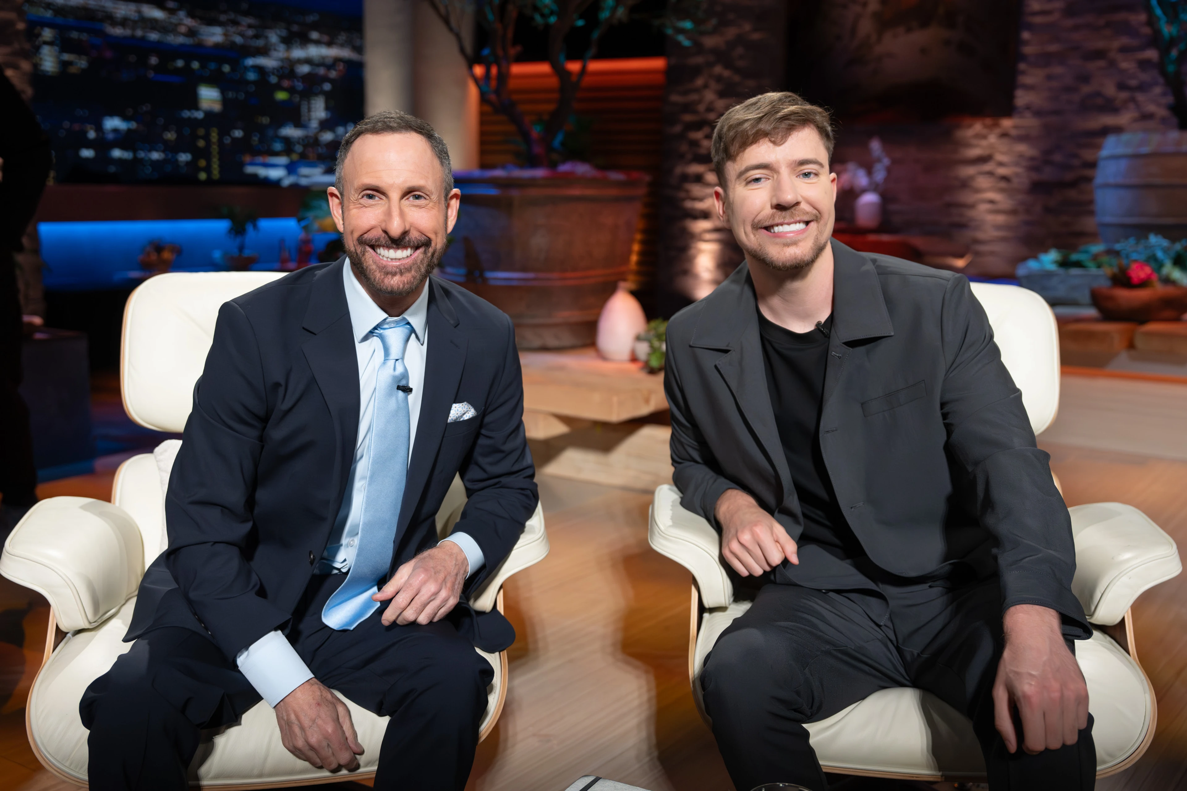 Jeff Housenbold and MrBeast sit together in the Shark Tank studio.