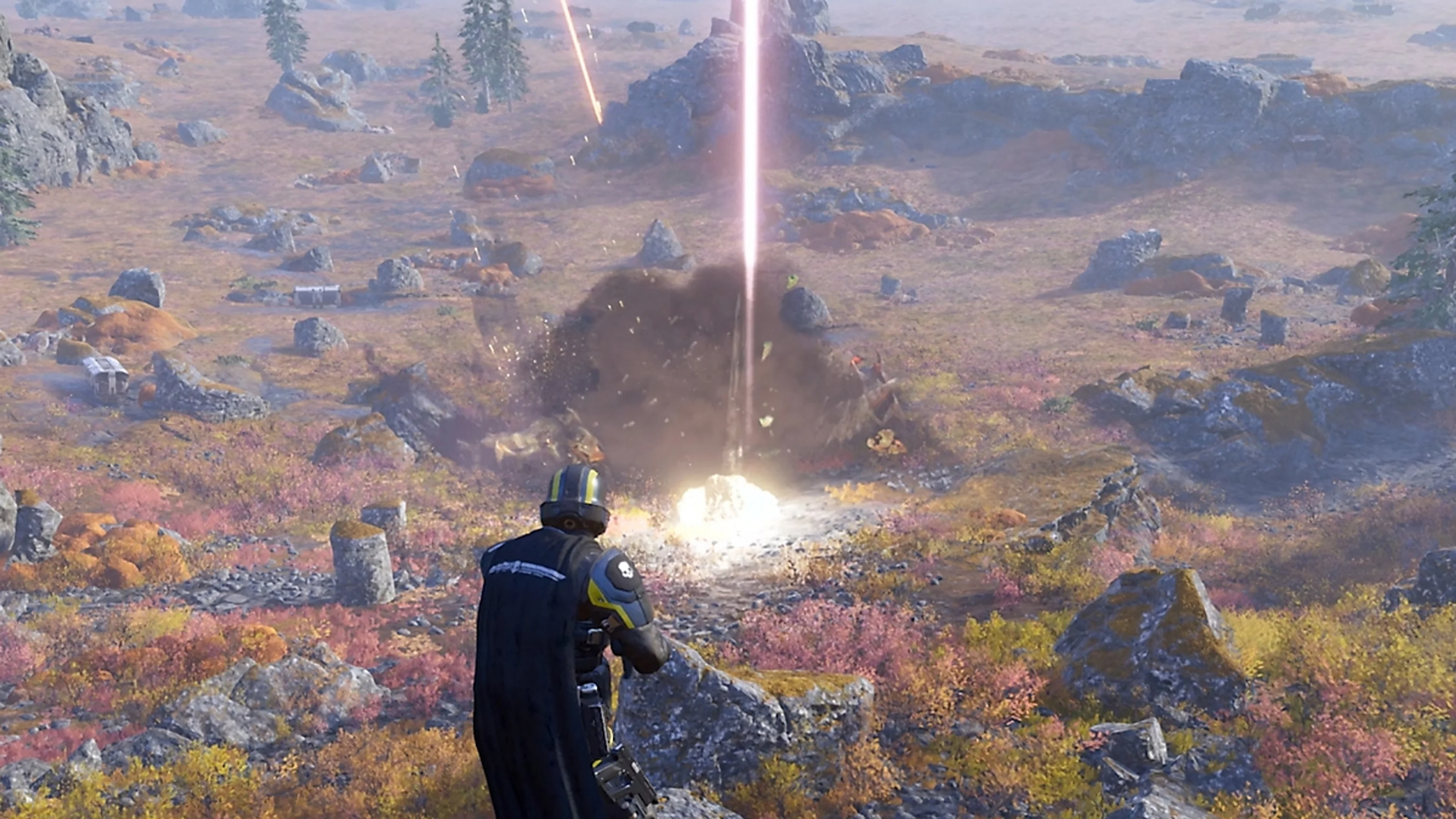 A Helldiver watches an Orbital Stratagem strike a distant target on an open battlefield.