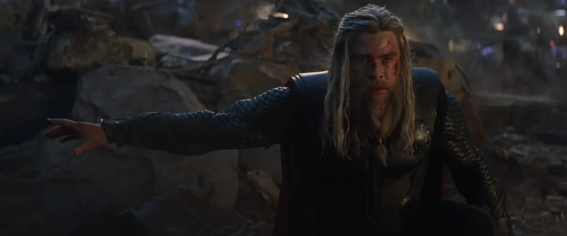 Thor kneels on the ruined battlefield during Avengers: Endgame.
