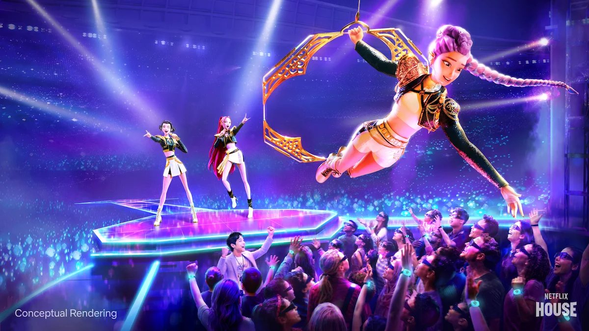 Concept art shows HUNTR/X performing above a crowd inside the KPop Demon Hunters immersive experience.