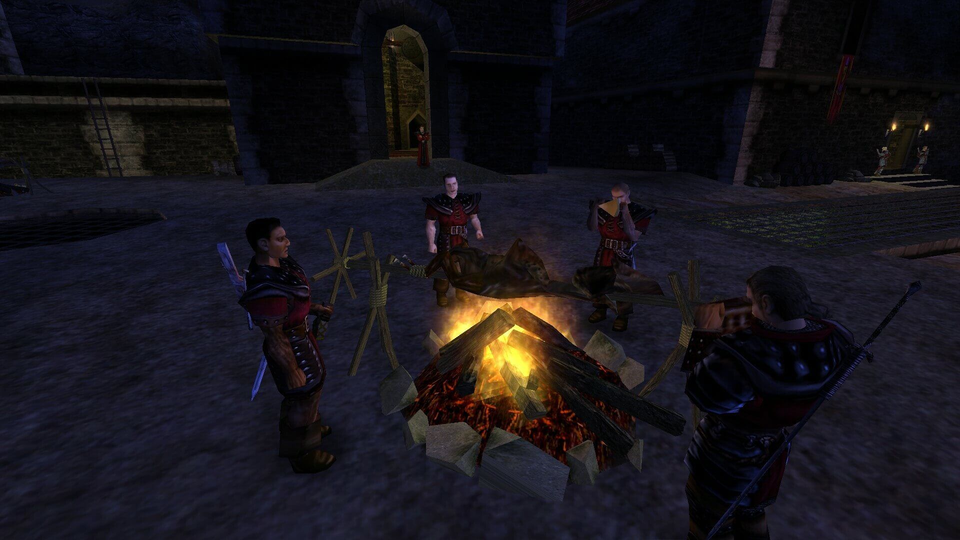Gameplay screenshot: armored characters stand around a campfire in a dark castle courtyard in Gothic Classic.