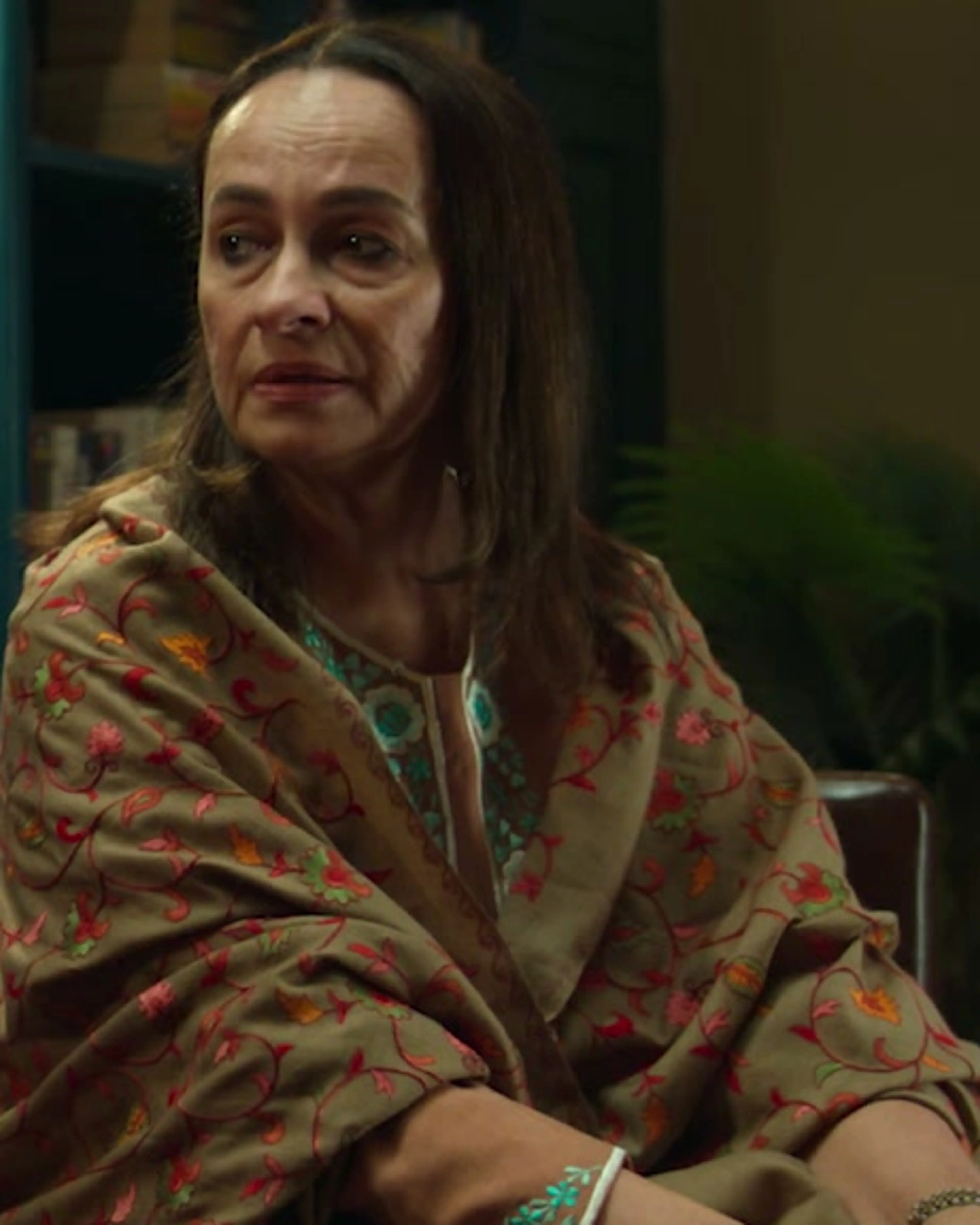 Soni Razdan as Madhu sits beside Tahir Raj Bhasin as her son Alok, who rests a hand against his head.