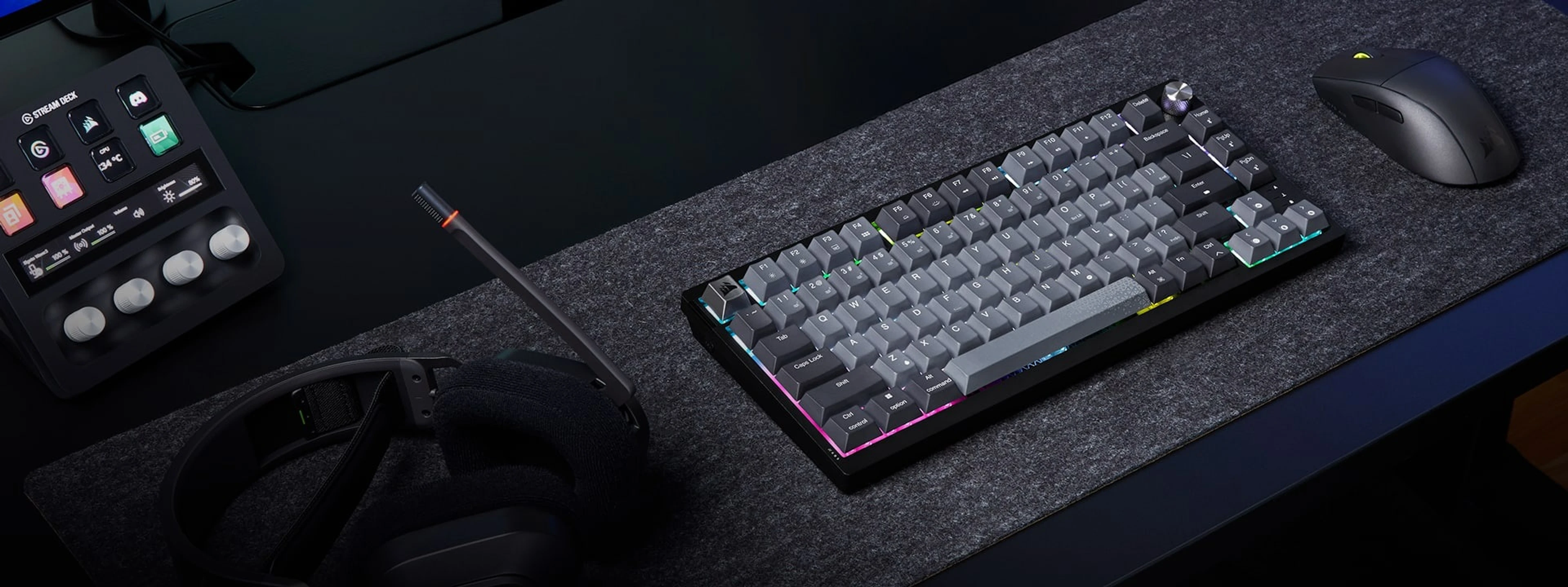 K65 Plus Wireless on a desk with a monitor and gaming mouse