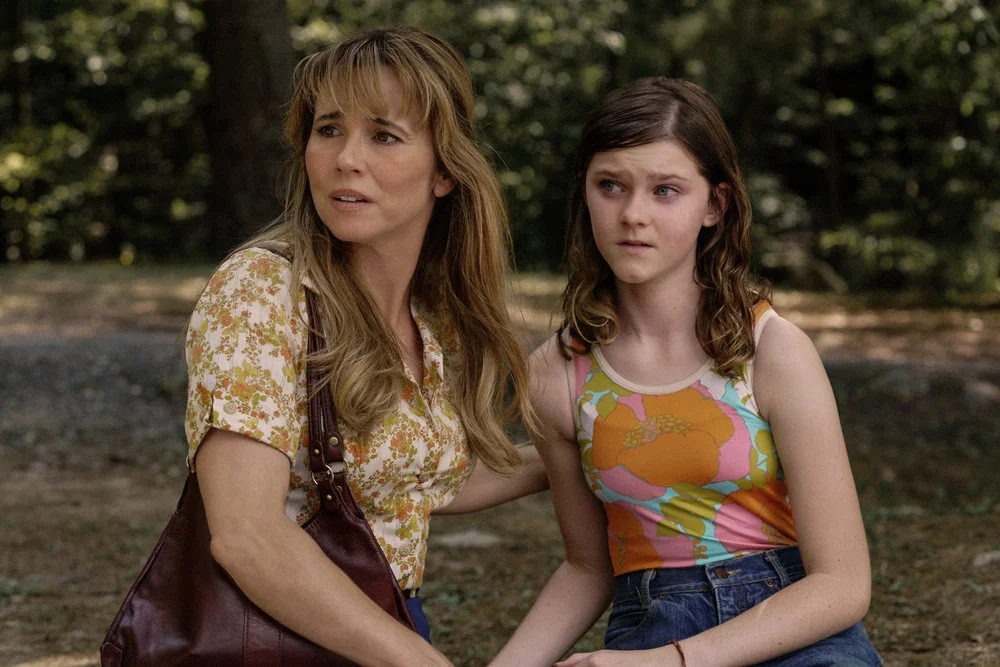 Pamela Voorhees and Grace look to the side in Crystal Lake.