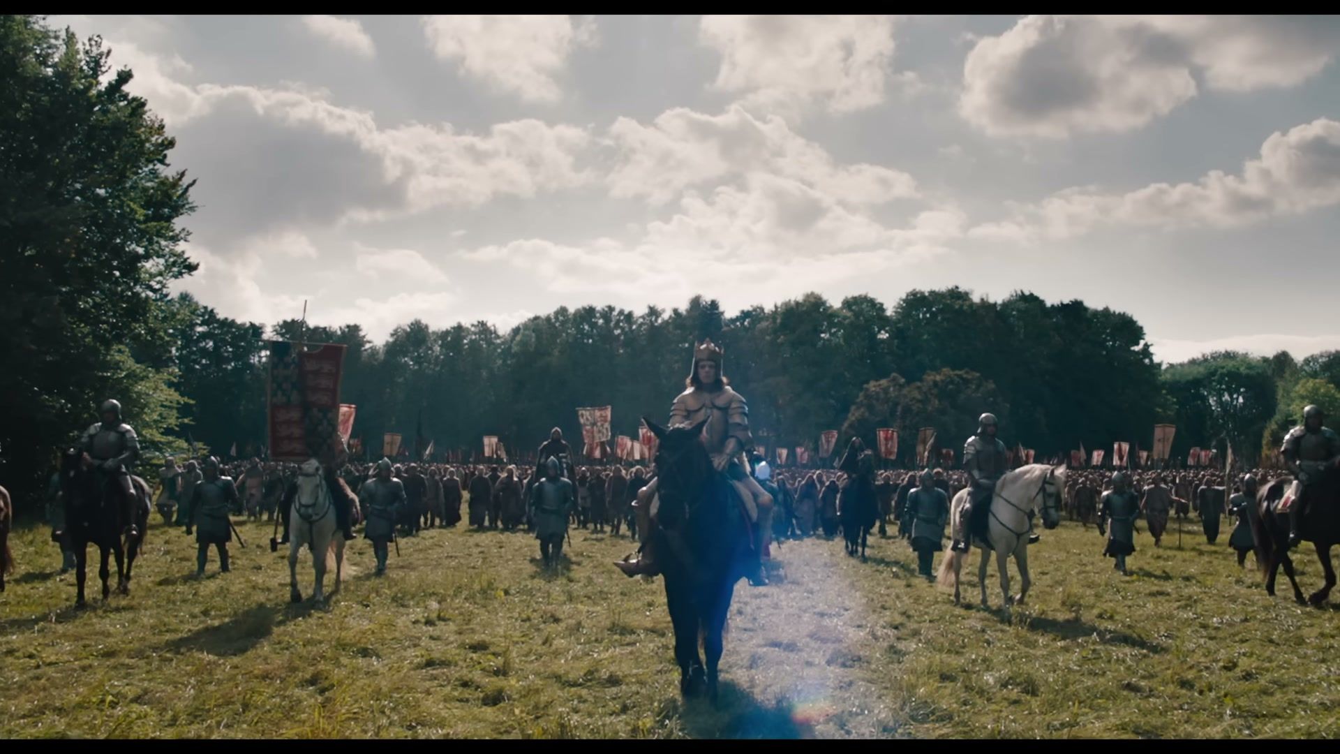 King Richard II rides in armor at the front of mounted soldiers.