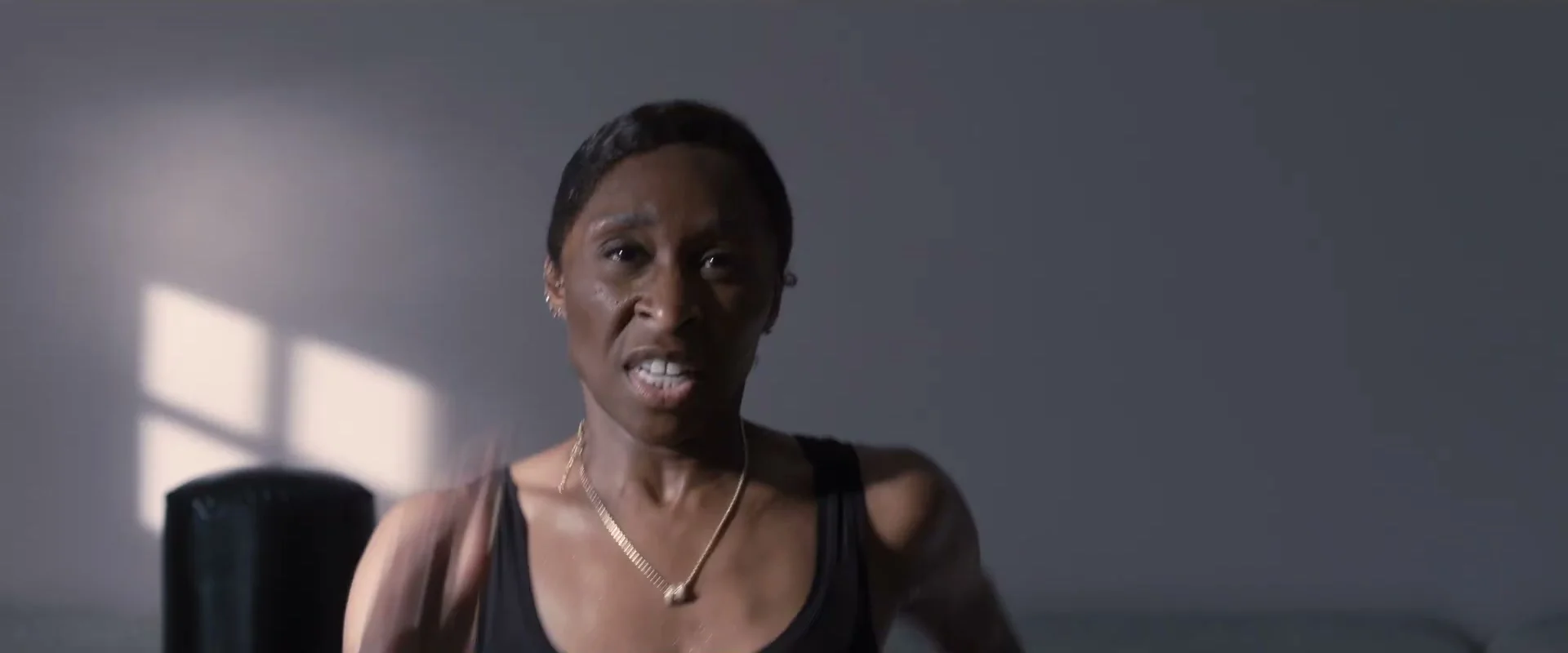 Cynthia Erivo as Tessa speaks from a chair in Prima Facie.