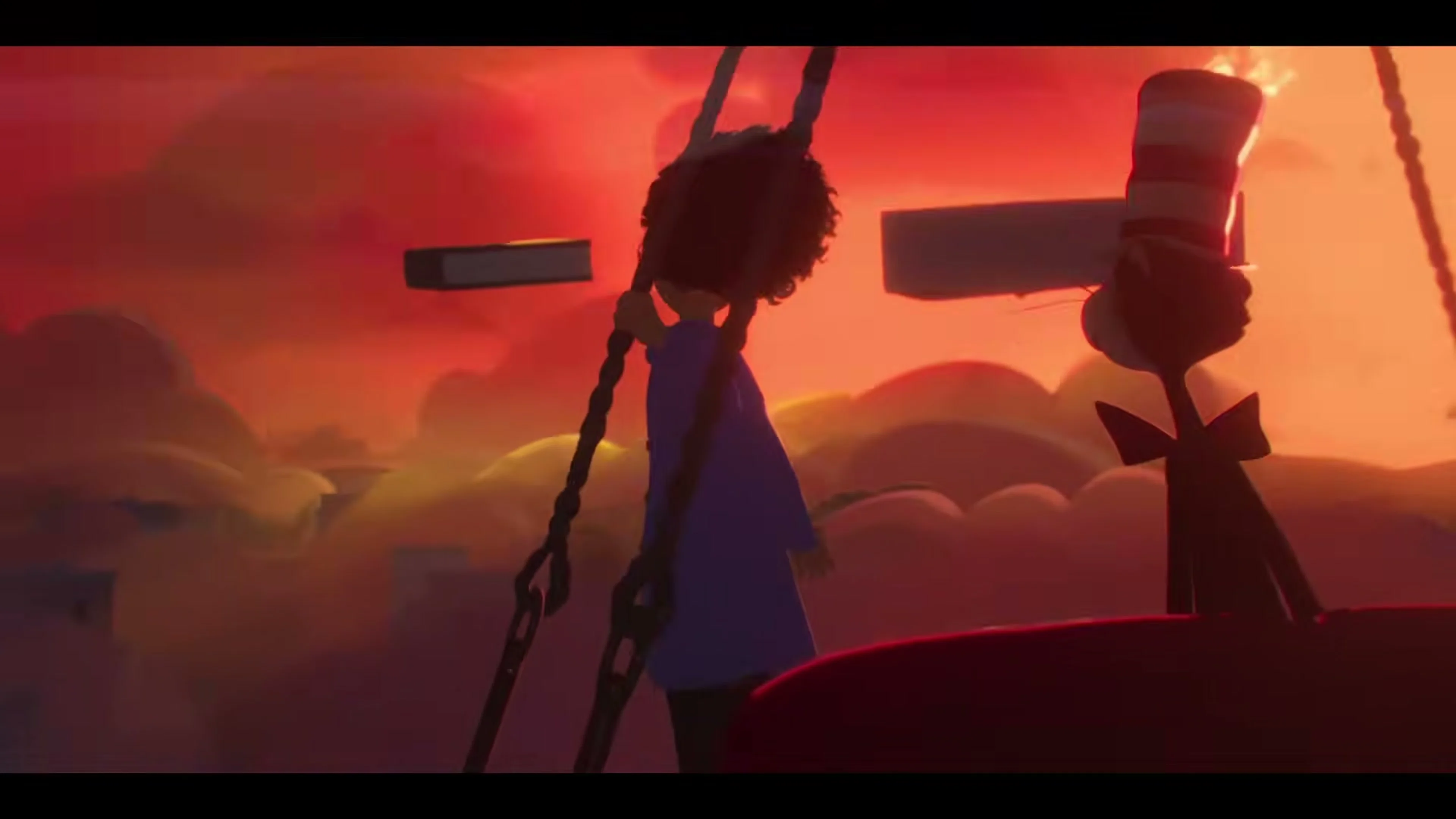 The Cat and Gabby swing high above a colorful sunset landscape in The Cat in the Hat main trailer.