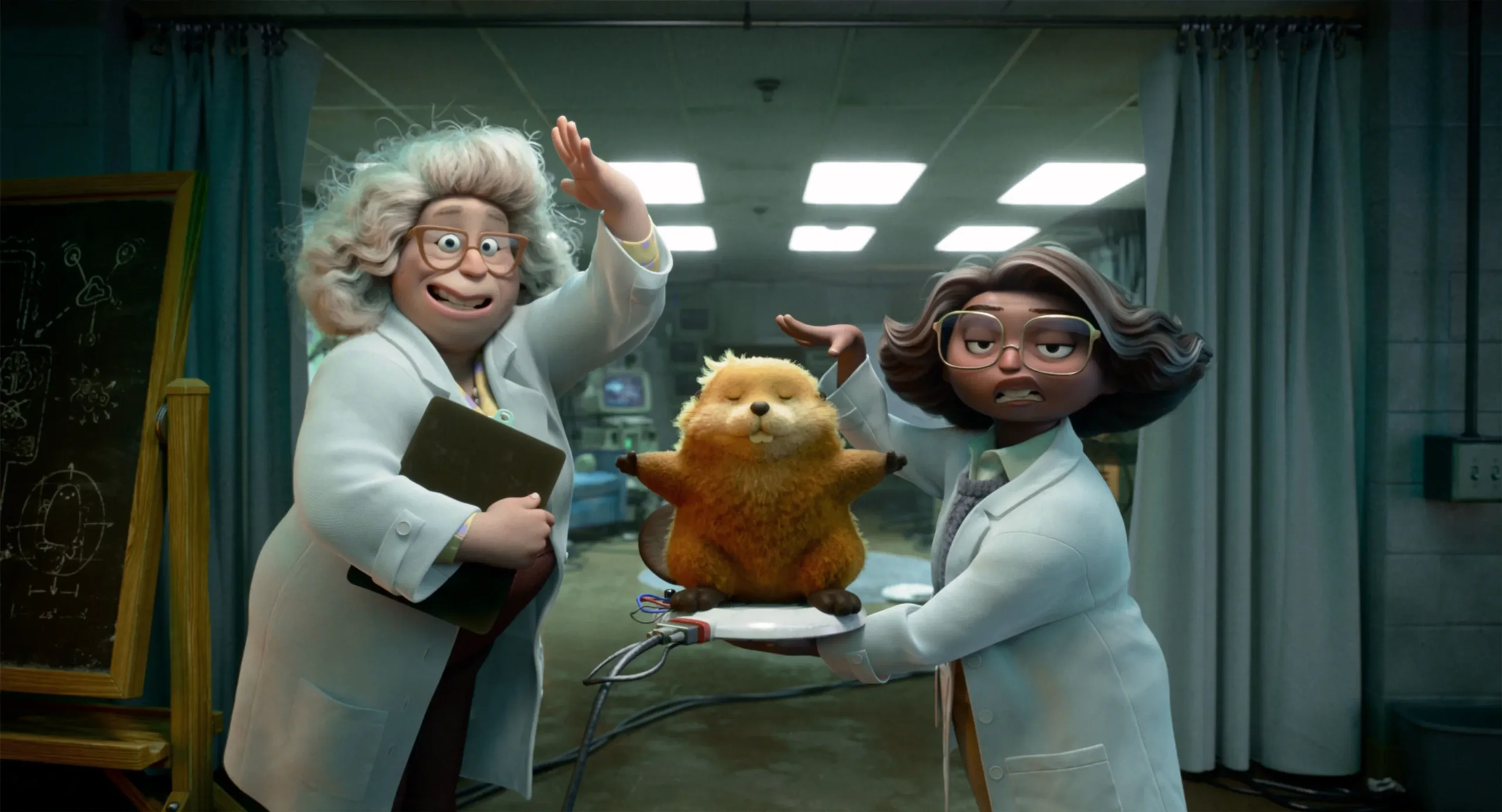 Dr. Sam and Dr. Nisha stand beside the robotic beaver in their laboratory.