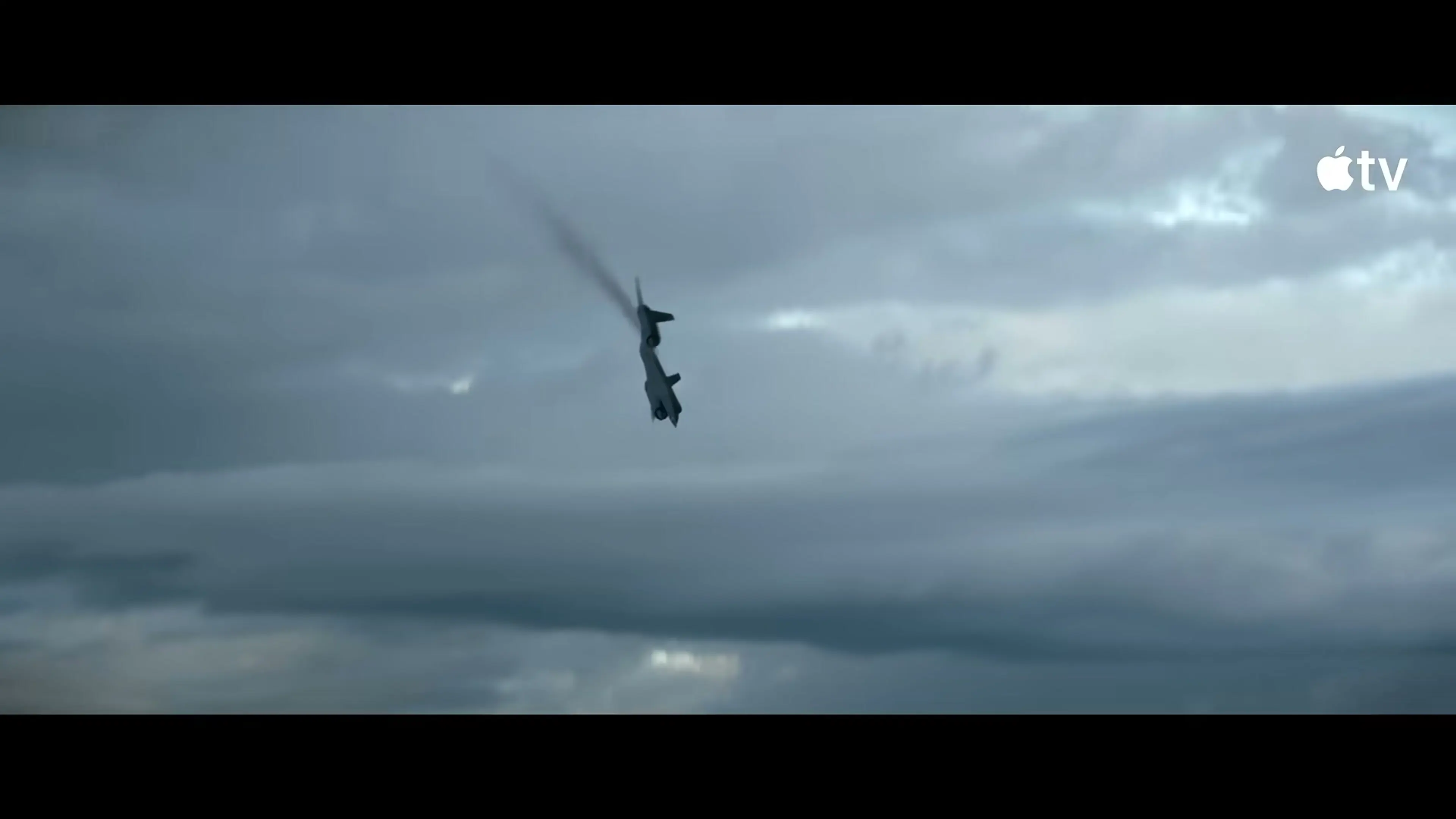 A lone figure falls through storm clouds during an aerial sequence in Mayday.