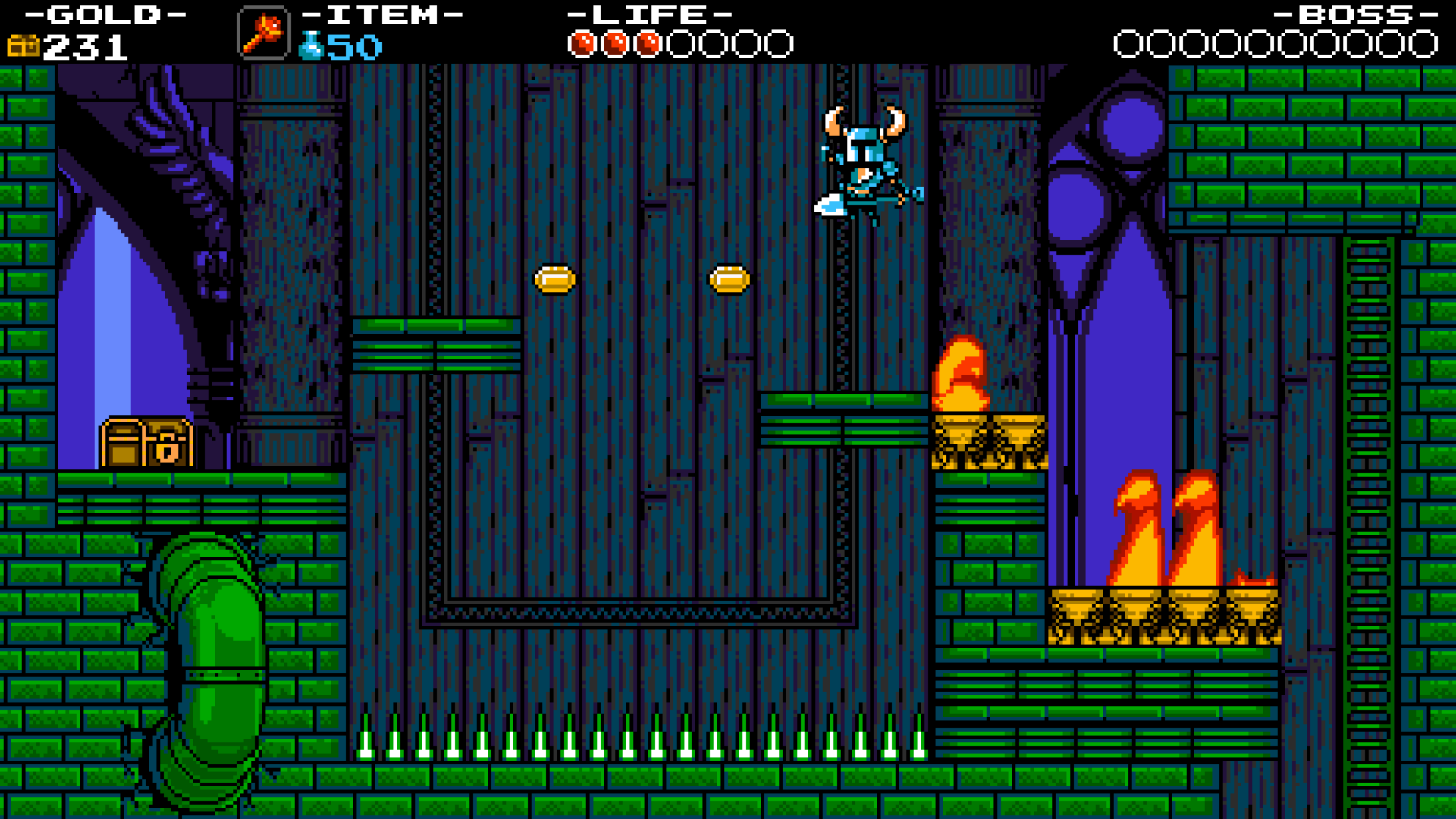 Shovel Knight jumps between green platforms above a row of spikes while fire burns to the right.