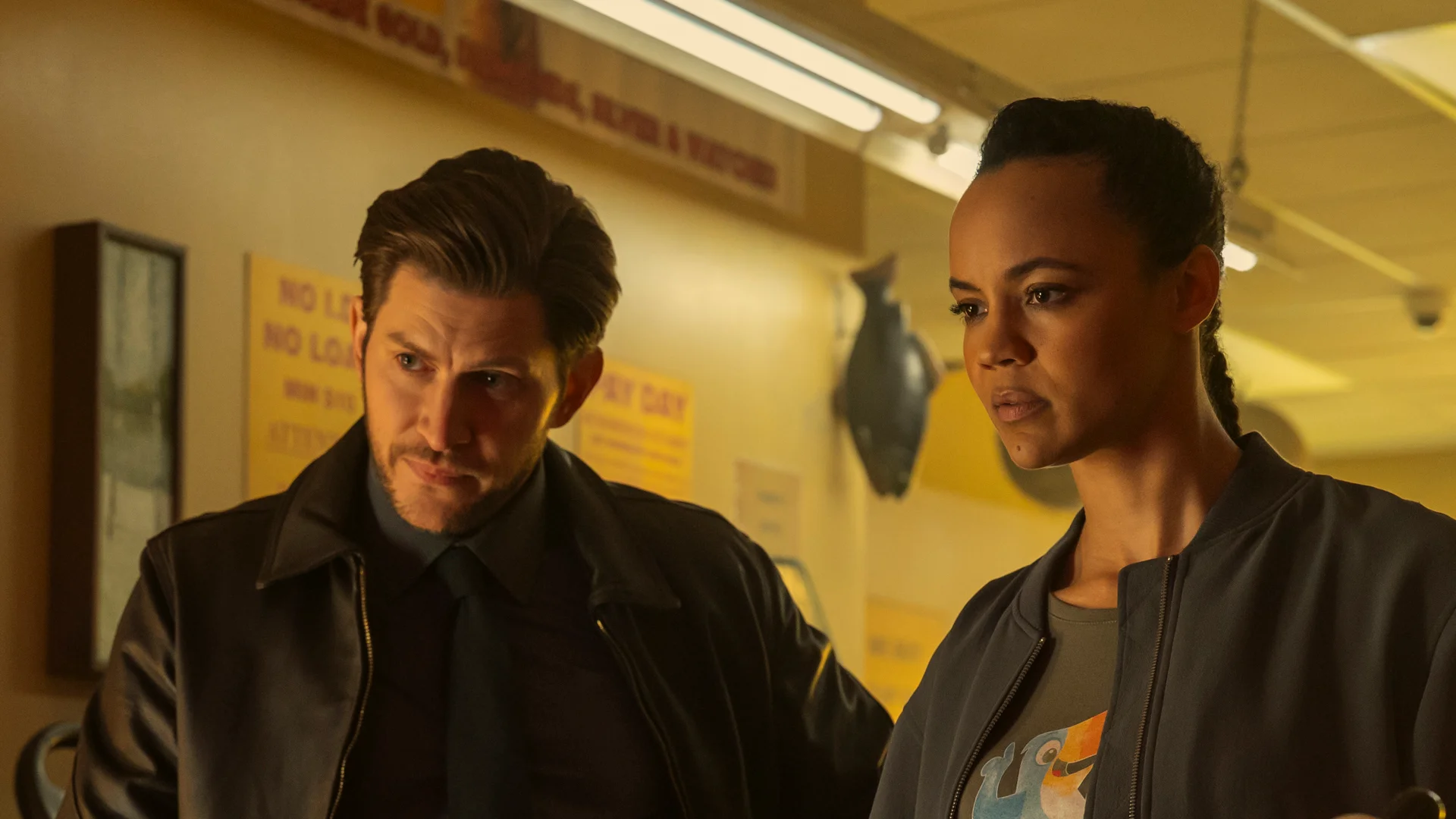 Frances Neagley stands beside Detective Hudson Riley inside a station.