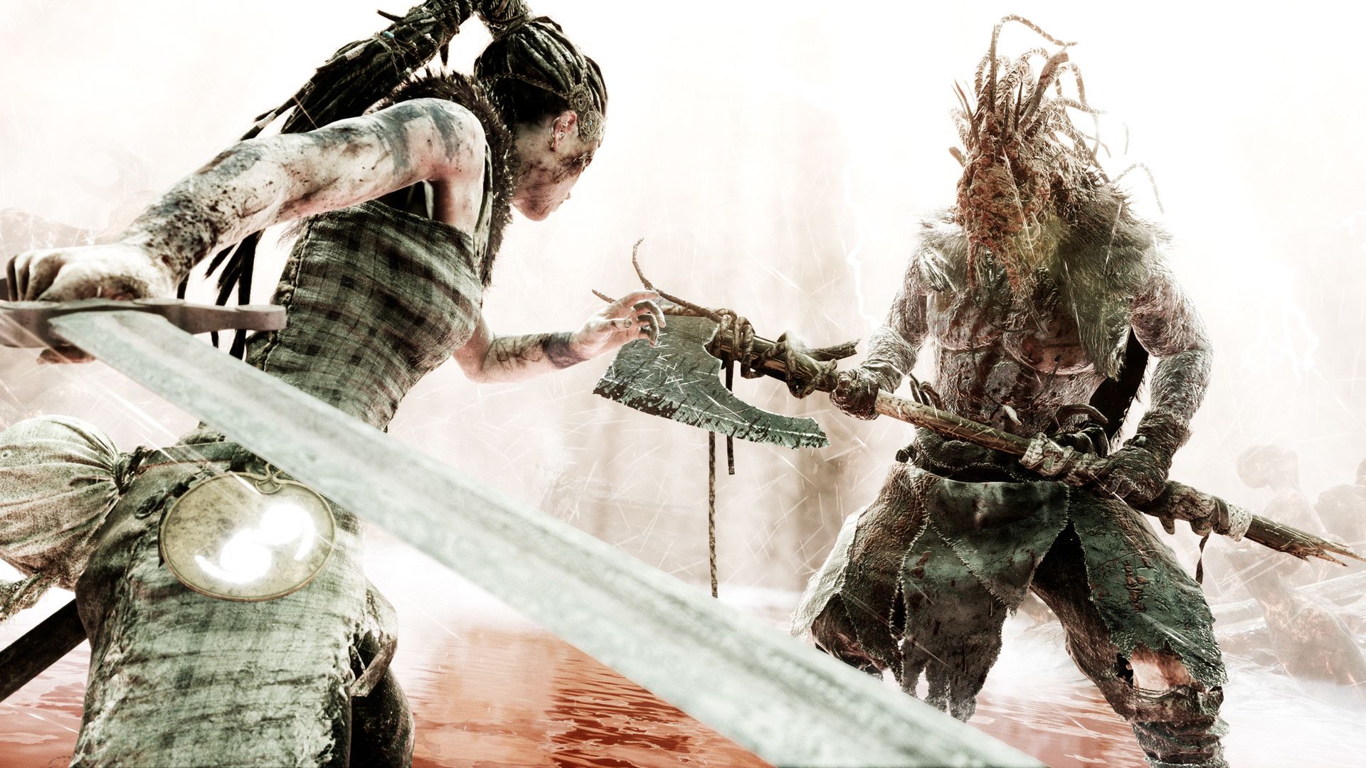 Senua fights an armed enemy at close range with her sword.